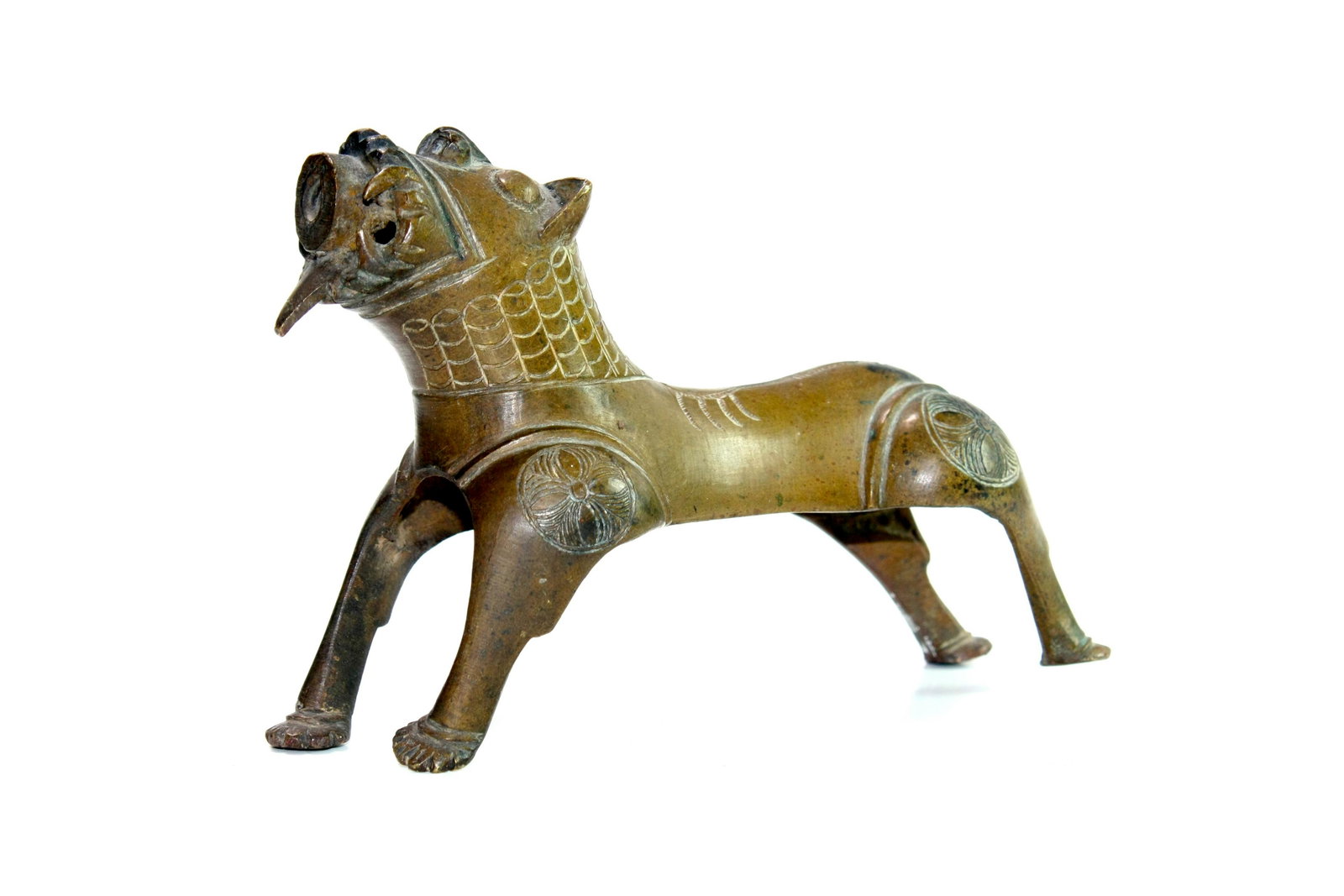 Antique Islamic Persian Bronze Lion.: Antique Islamic Persian Bronze Lion. Size 6 1/4 inches length x 4 3/8 inches high. Fine cast bronze lion, fountain spout. decorated with floral design. Provenance: Private New York collection.