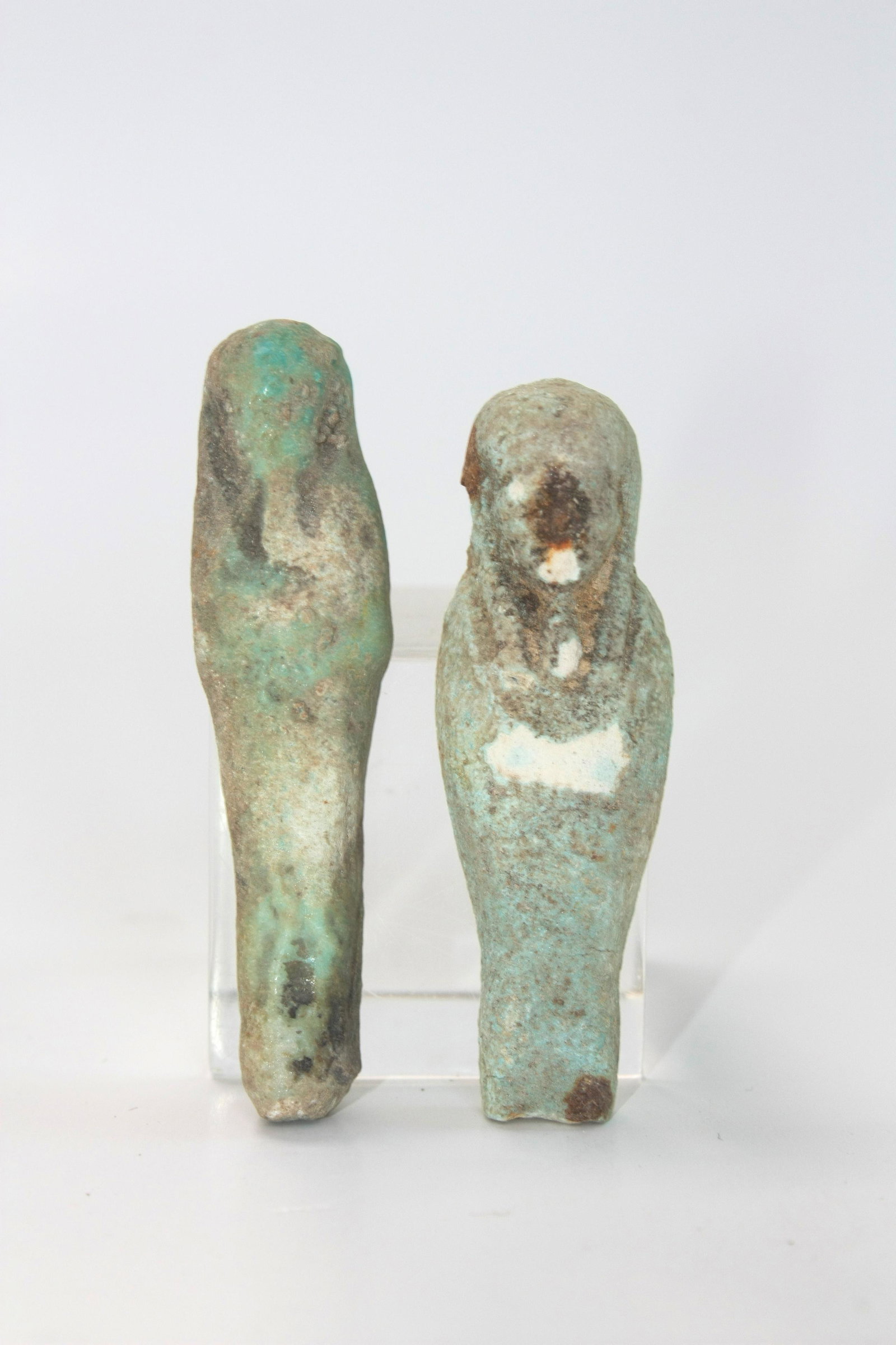 Lot of 2 Ancient Egyptian Blue/Green Faience Ushabti: Lot of 2 Ancient Egyptian Blue/Green Faience Ushabti Figures c.664-332 BC. Size 2 3/4 - 2 1/2 inches high. Fine blue/green glazed faience ushabti figures, wearing the royal wig and beard, holding impl