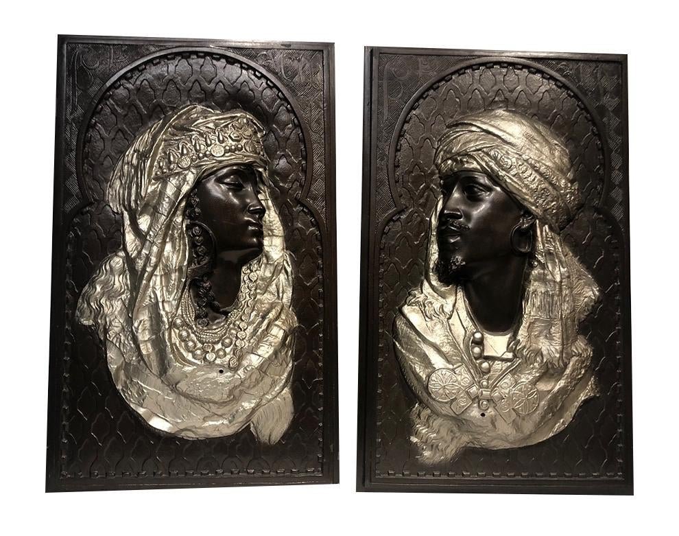 A Pair of plaques Depicts two Arabian figures by Arthur: A Pair of plaques Depicts two Arabian figures by Arthur Waagen (German) Size 24 x 14 1/4 inches. Fine pair of cast white metal depicts two Arabian figures polychrome painted in bronze, and silver colo