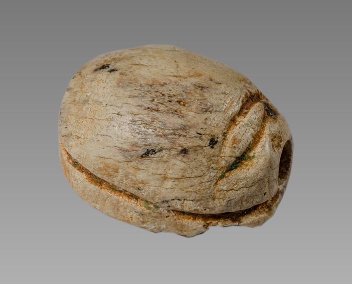 Ancient Egyptian Steatite stone Scarab c.1500-1100 BCE.: Ancient Egyptian Steatite stone Scarab c.1500-1100 BCE. Size 13 x 10 mm. Glazed steatite scarab New Kingdom with stealized beatle back and bezel with lion facing right at base. Provenance: Ex Secret E