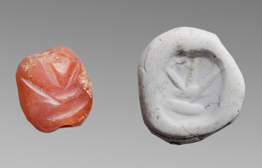 Ancient Western Asiatic Carnelian Stamp Seal c.3000 BC.: Ancient Western Asiatic Carnelian Stamp Seal c.3000 BC. Size 14 x 13 mm. Carved Carnelian Stamp seal with oval face with stylized flower, back is scaraboid with central peak. Provenance: Ex Eldert Bon
