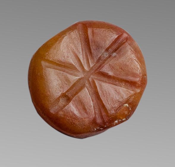 Ancient Mesopotamian Carnelian Seal c.3000 BC.: Ancient Mesopotamian Carnelian Seal c.3000 BC. Size 17 x 15 mm. Carved carnelian stamp seal engraved with six-armed star on oval face. domed back and transverse strining hole. Provenance: Ex Eldert Bo