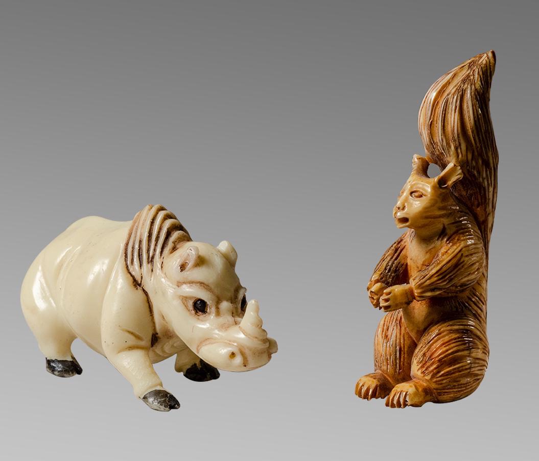 Lot of 2 Painted Bone Netsuke's China. Rhino and: Lot of 2 Painted Bone Netsuke's China. Rhino and Squirrel. size of frame 2 1/4 - 2 inches. Used to tie sashin ceremonial dress These are made of Bone-resin. Provenance: Ex Eldert Bontekoe, Pegasi. Ann
