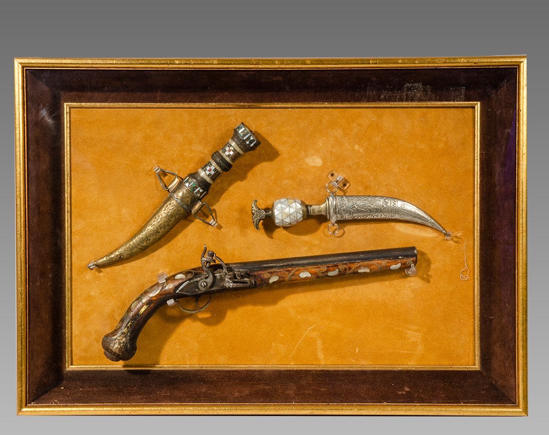 Antique Ottoman Turkish Pistol, Daggers c.late 19th: Antique Ottoman Turkish Pistol, Daggers c.late 19th century. Size 17 1/4 inches length (pistol) together with two daggers size 11 - 11 5/8 inches. decorative pieces, custom mounted in a frame for pres