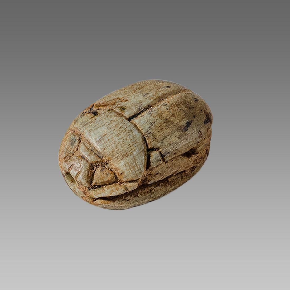 Ancient Egyptian Steatite stone Scarab c.1500-1100 BCE.: Ancient Egyptian Steatite stone Scarab c.1500-1100 BCE. Size 21 x 15 mm. Glazed steatite scarab New Kingdom with stealized beatle back. Provenance: Ex Secret Eyes Gallery New York 1970's-1980's.
