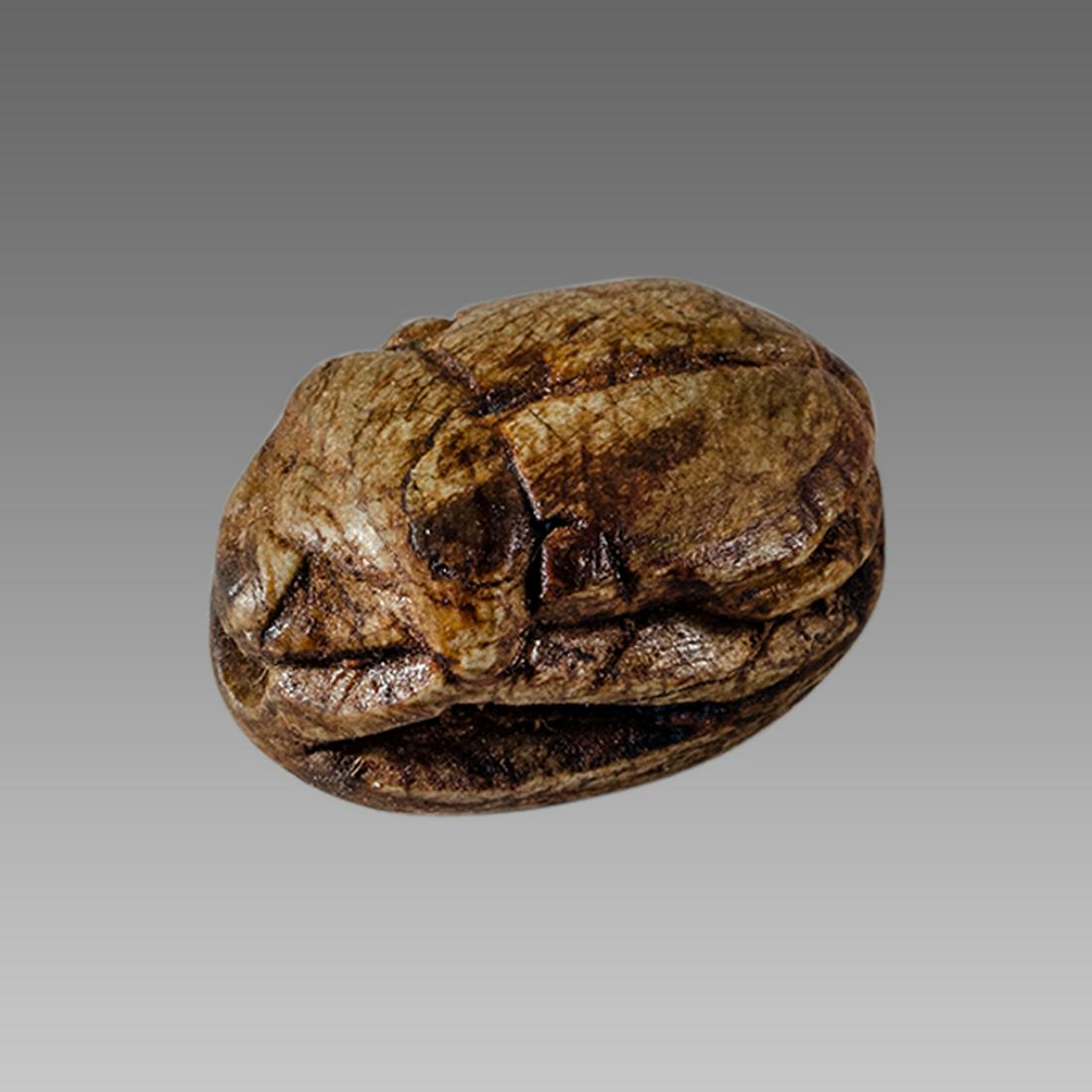 Ancient Egyptian Steatite stone Scarab c.1500-1100 BCE.: Ancient Egyptian Steatite stone Scarab c.1500-1100 BCE. Size 15 x 11 mm. Glazed steatite scarab New Kingdom with stealized beatle back. Provenance: Ex Secret Eyes Gallery New York 1970's-1980's.