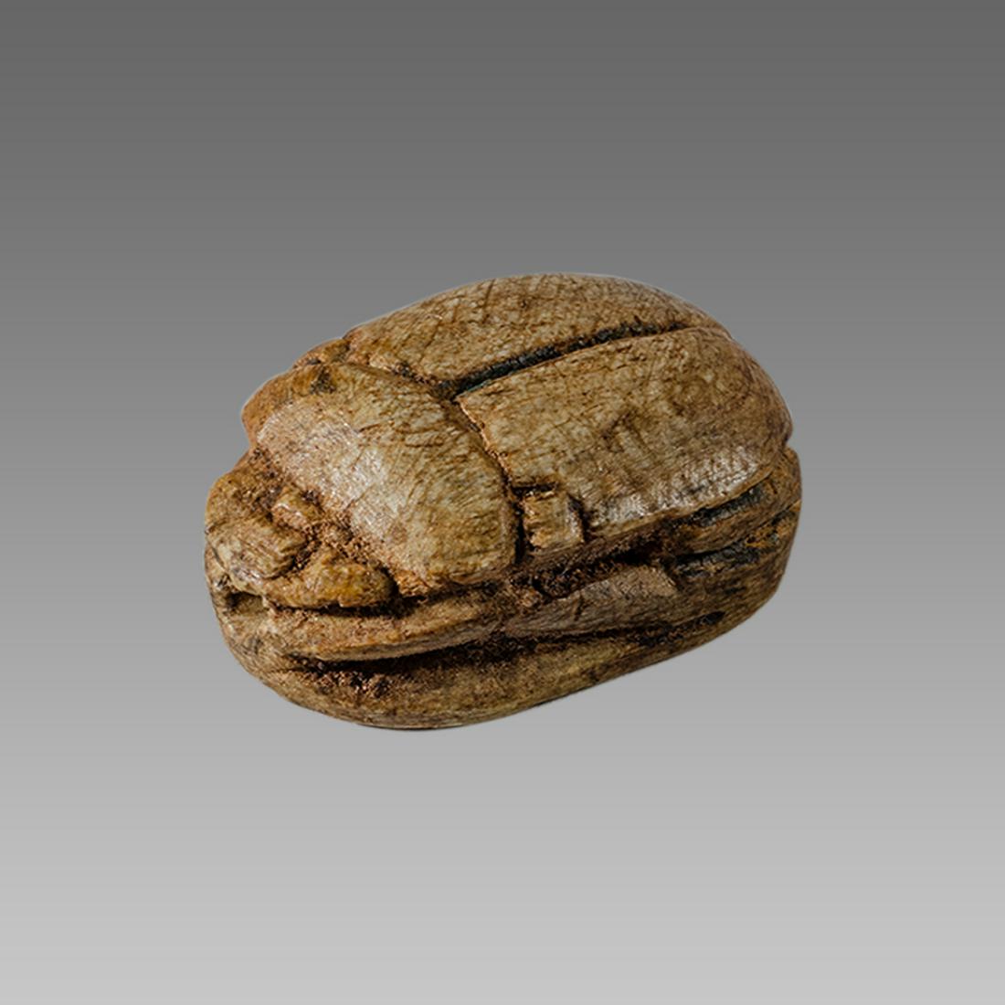 Ancient Egyptian Steatite stone Scarab c.1500-1100 BCE.: Ancient Egyptian Steatite stone Scarab c.1500-1100 BCE. Size 16 x 11 mm. Glazed steatite scarab New Kingdom with stealized beatle back. Provenance: Ex Secret Eyes Gallery New York 1970's-1980's.