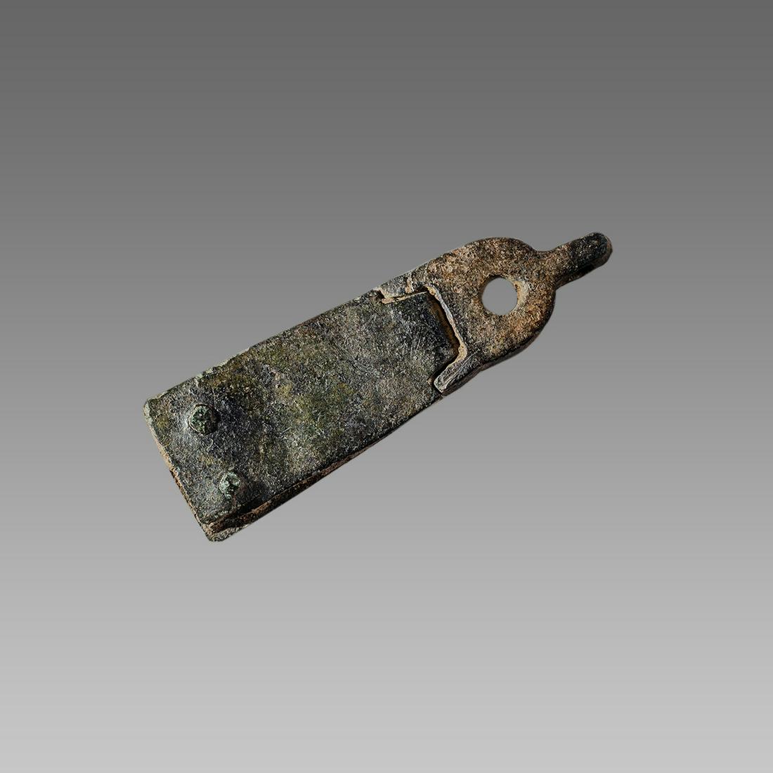 England, Bronze Strap end with wolf's head c.1350-1400: England, Bronze Strap end with wolf's head c.1350-1400 AD. Size 2 inches length. Bronze Strap end with stylized wolf's head terminal. Found in Lincolnshire. Provenance: Ex Eldert Bontekoe, Pegasi. Ann