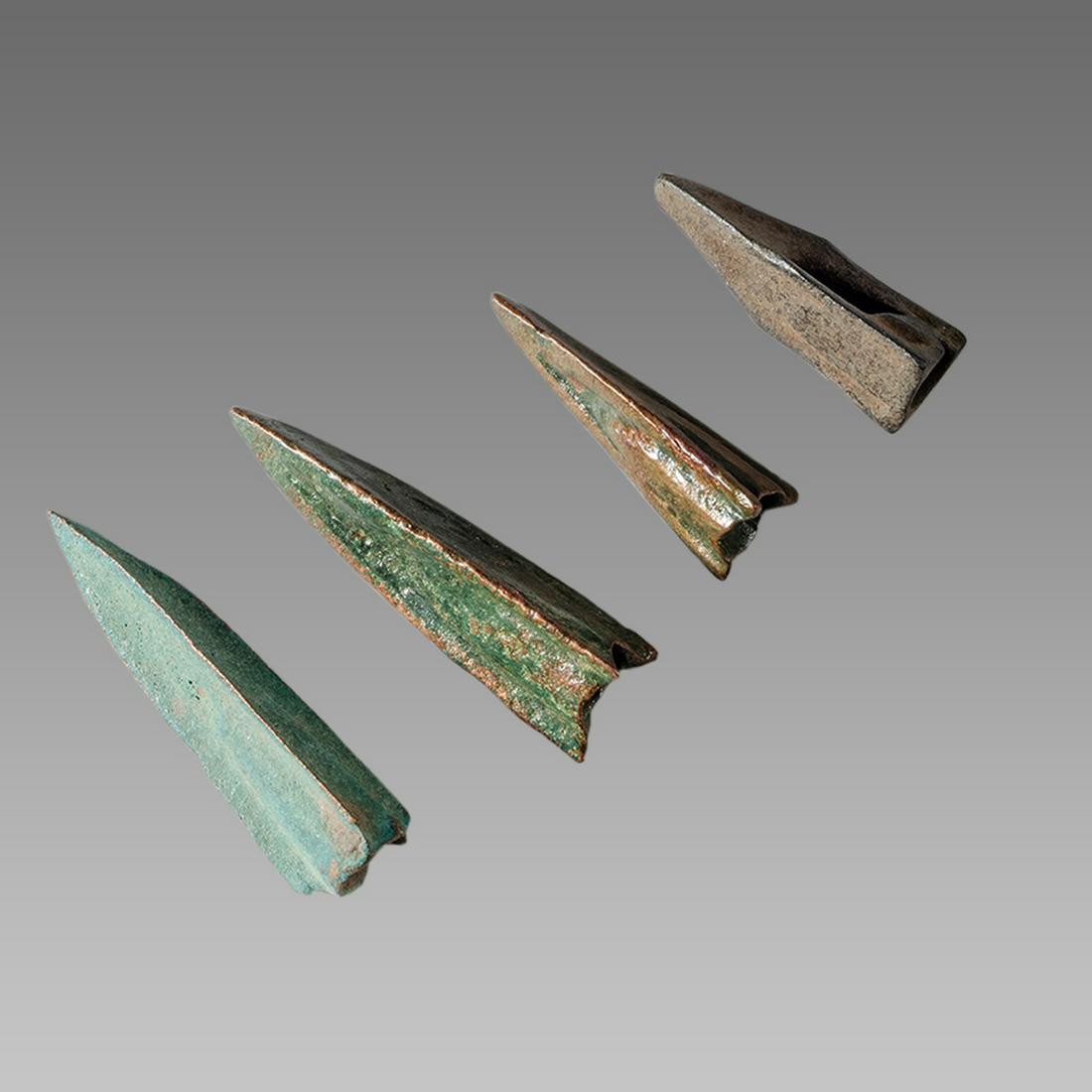Lot of 4 Ancient Roman Republic Bronze Arrow heads c.50: Lot of 4 Ancient Roman Republic Bronze Arrow heads c.50 BC. Size 0 3/4- 1 1/8 inch length. fine lot of 4 bronze arrow heads with with three flat sides, one side holed for addition of spur, circular so