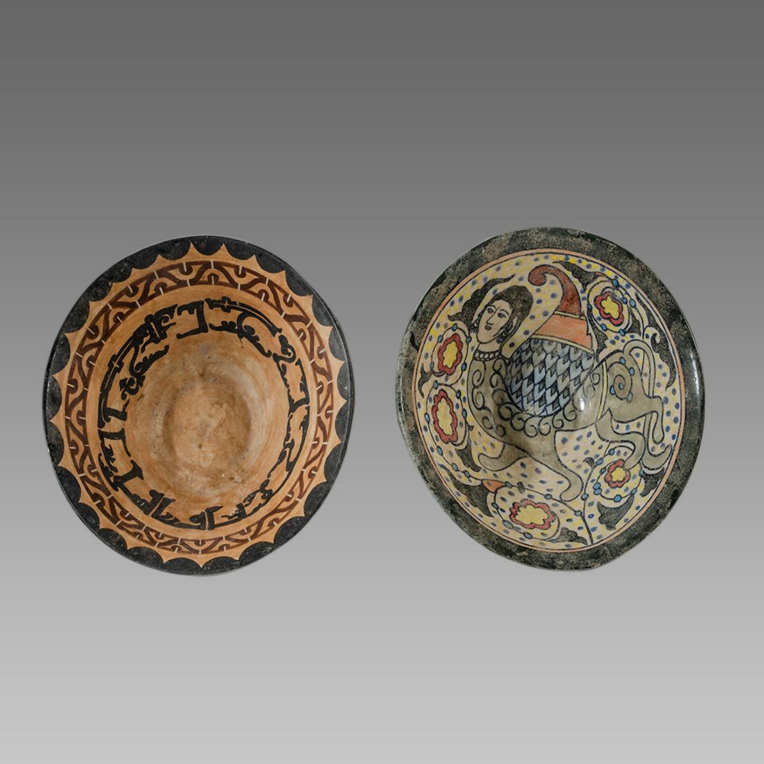 Lot of 2 Islamic Persian Cermaic Bowls.: Lot of 2 Islamic Persian Cermaic Bowls. Size 10 inches diameter. A Kashan style cermaic bowls. 20th century. with Calligraphy and figure of Sphinx.