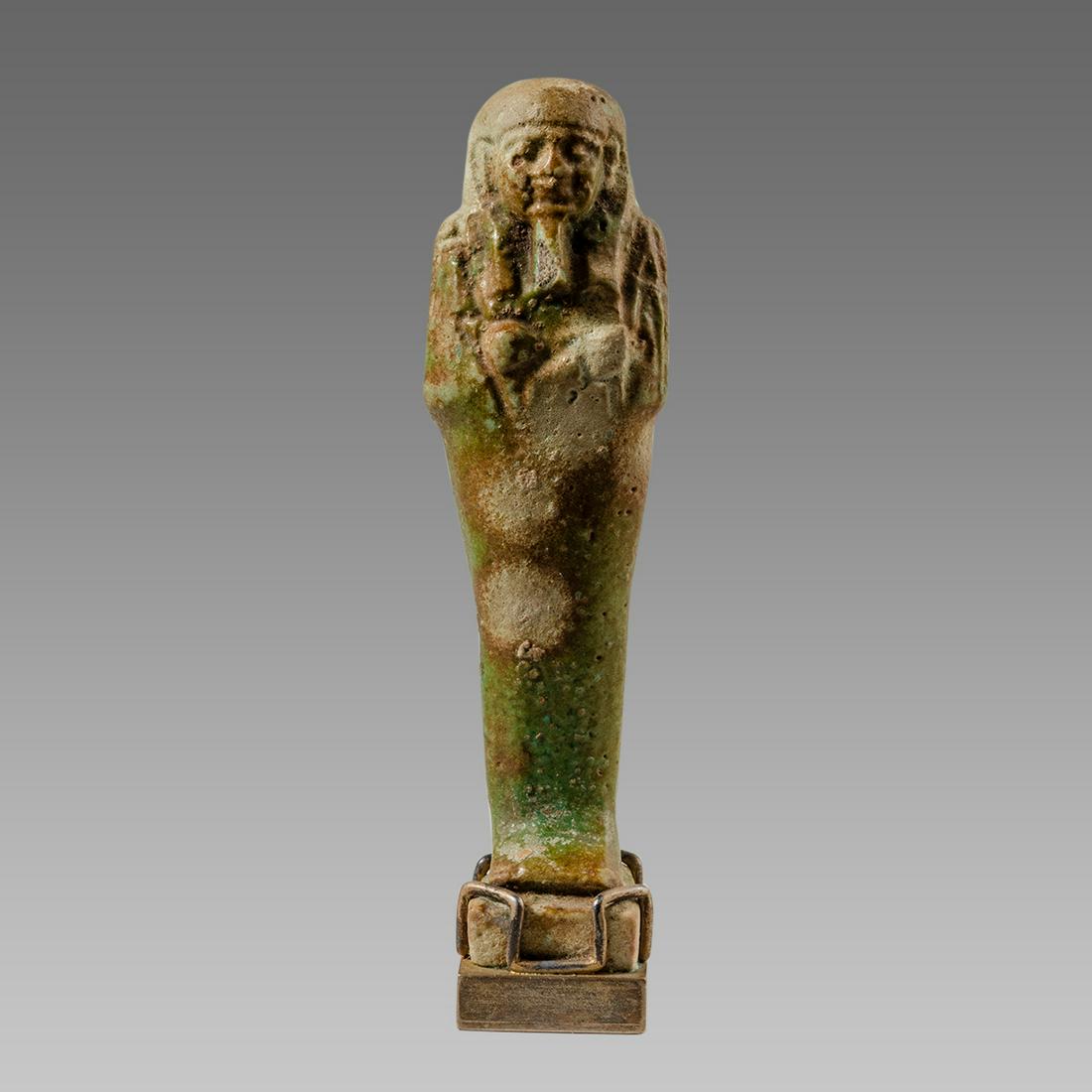 Ancient Egyptian Green Faience Ushabti Late period: Ancient Egyptian Green Faience Ushabti Late period c.664-332 BC. Size 3 3/8 inches high. + mount. Late Period, 26th Dynasty, ca. 664 to 332 BCE. Fine green faience ushabti, mummiform figure standing o