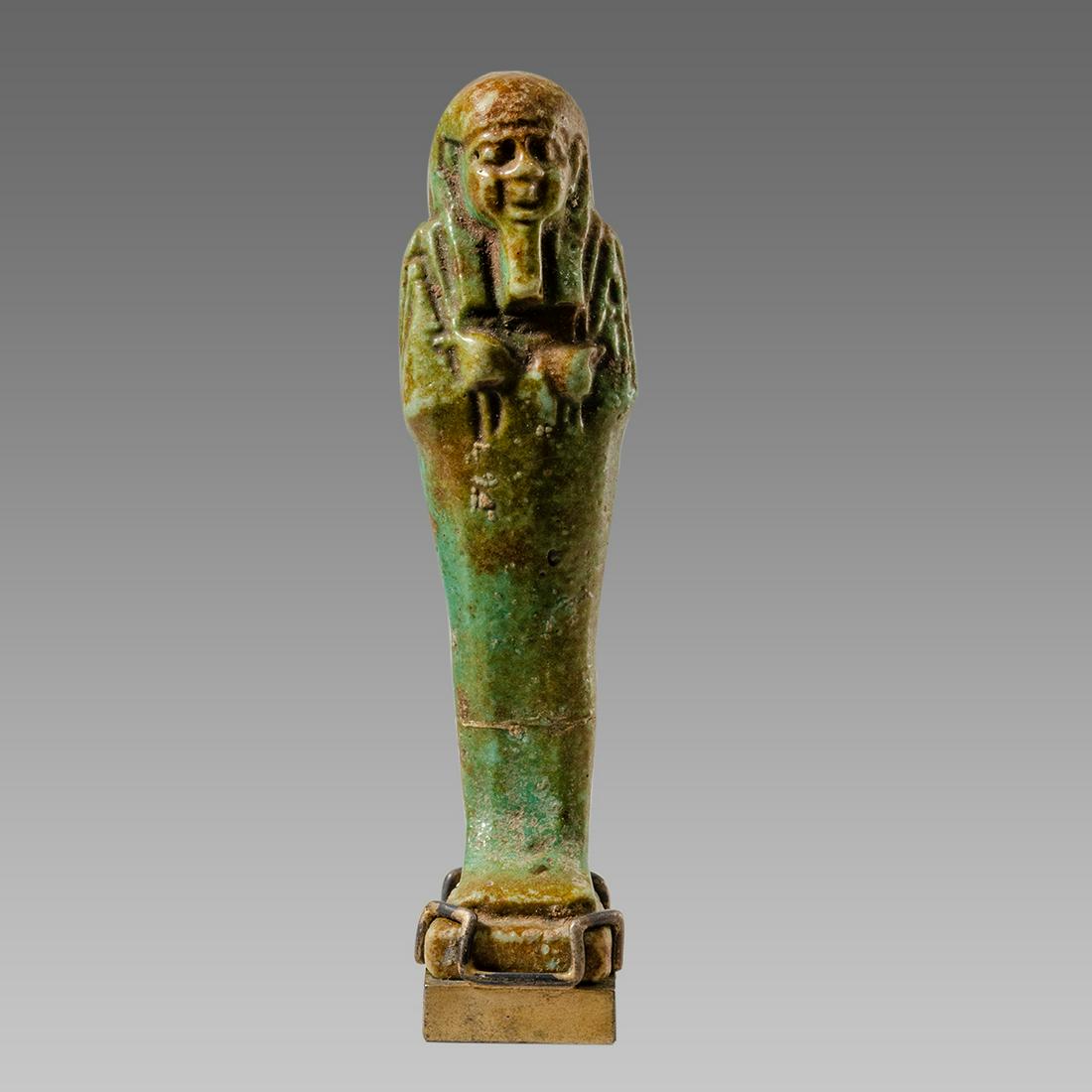 Ancient Egyptian Green Faience Ushabti Late period: Ancient Egyptian Green Faience Ushabti Late period c.664-332 BC. Size 3 3/8 inches high. + mount. Late Period, 26th Dynasty, ca. 664 to 332 BCE. Fine green faience ushabti, mummiform figure standing o