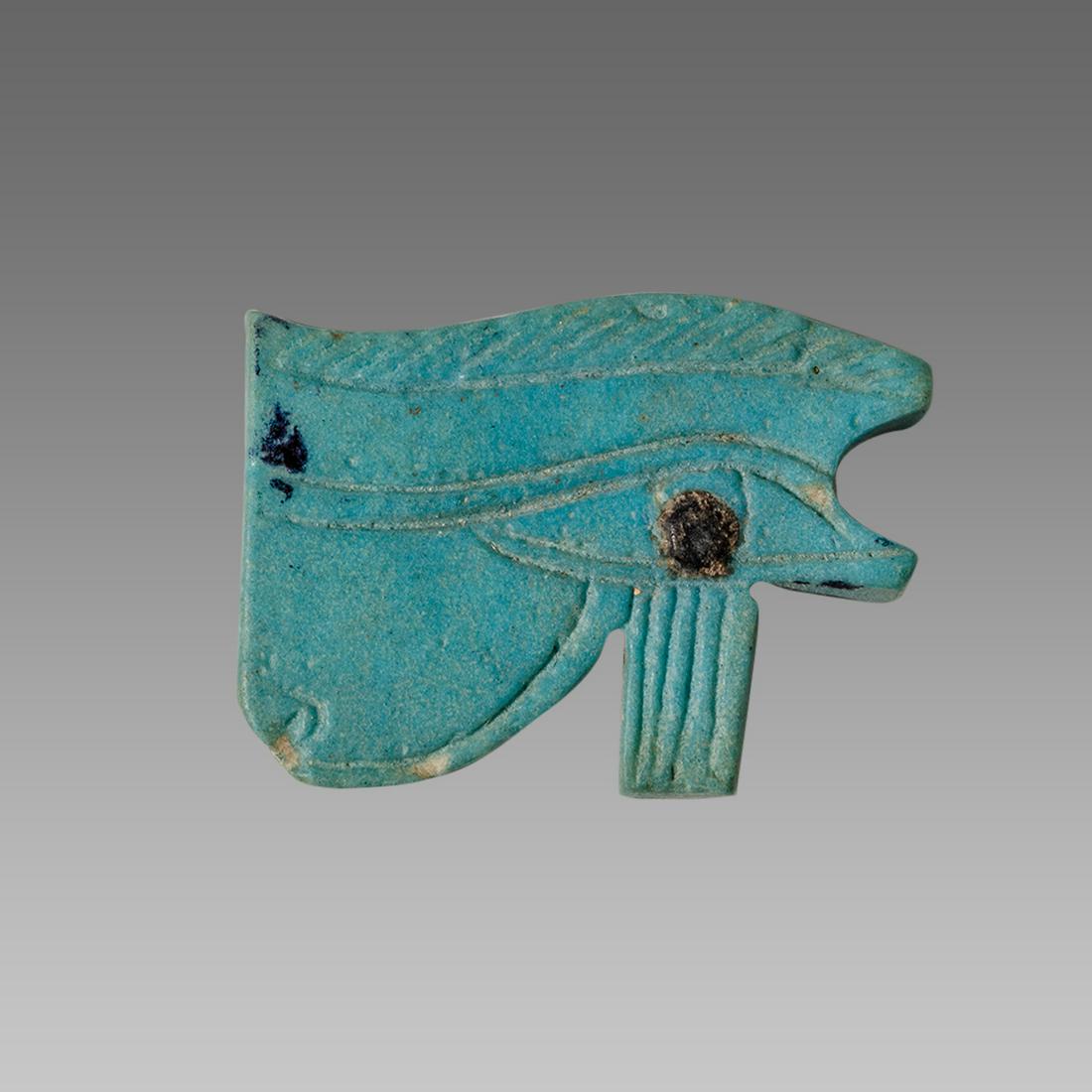 Ancient EGYPTIAN Faience Wedjet Eye Of Horus Late: Ancient EGYPTIAN Wedjet Eye Of Horus Amulet Late Period. 664-332 BCE. Size 27 mm. Fine blue faience Wedjet Eye Of Horus amulet with inscised details. Provenance: Private NYC acquired from London Marke