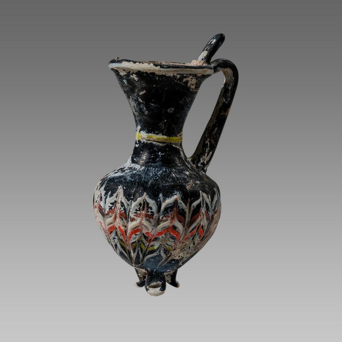 Islamic Style Mosaic millefiori glass Footed Vessel: Islamic Style Mosaic millefiori glass Footed Vessel Jug. Size 3 5/8 inches high. Lovely form footed glass jug with millefiori pattern.
