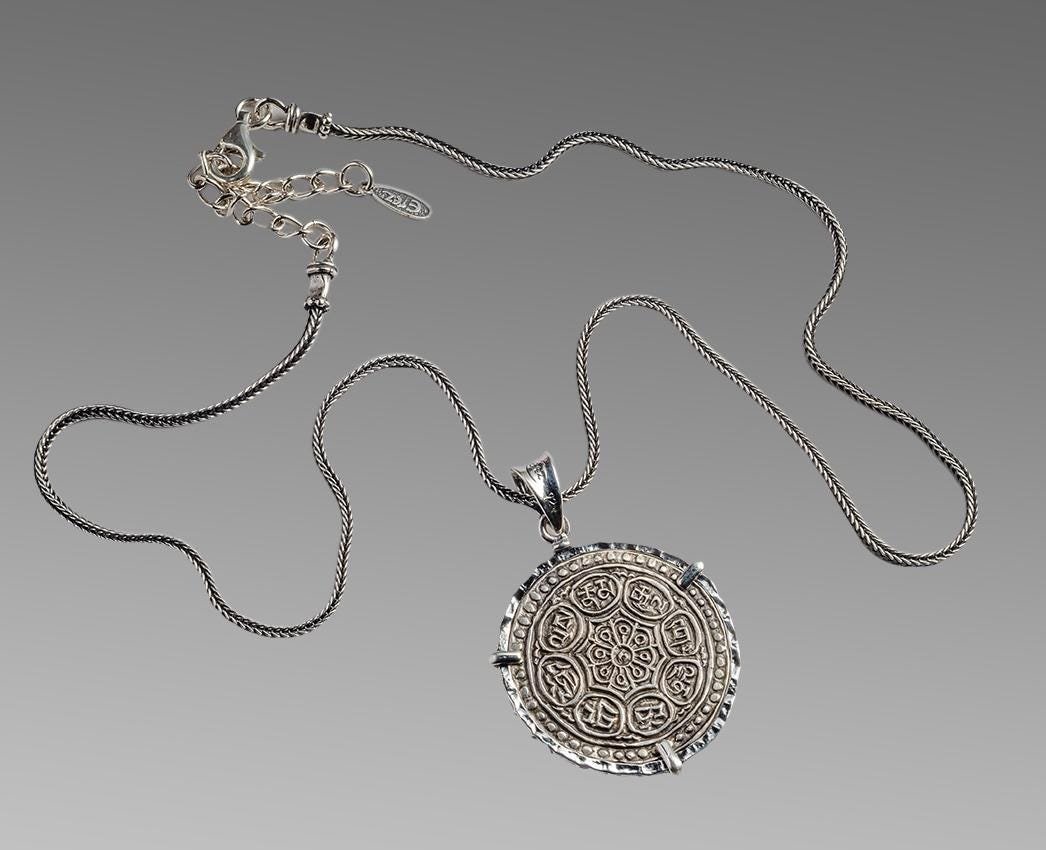 Antique Silver coin Tibet Tangka set in Silver Necklace: Antique Silver coin Tibet Tangka set in Silver Necklace 1850-1948. Fine condition. Tibet silver coin set in Modern Silver necklace. wearable. Size 18 inches length, bezel 30 mm diameter.