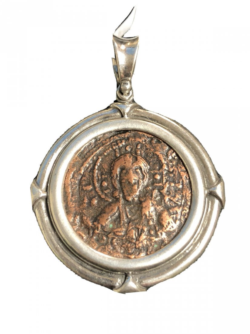 Ancient Byzantine Bronze coin set in Silver Pendant c.1: Ancient Byzantine Bronze coin set in Silver Pendant c.10th century AD. Authentic Byzantine Empire Christ facing Bronze coin, Very Fine condition. The coin is authentic set in Modern Silver pendant. we