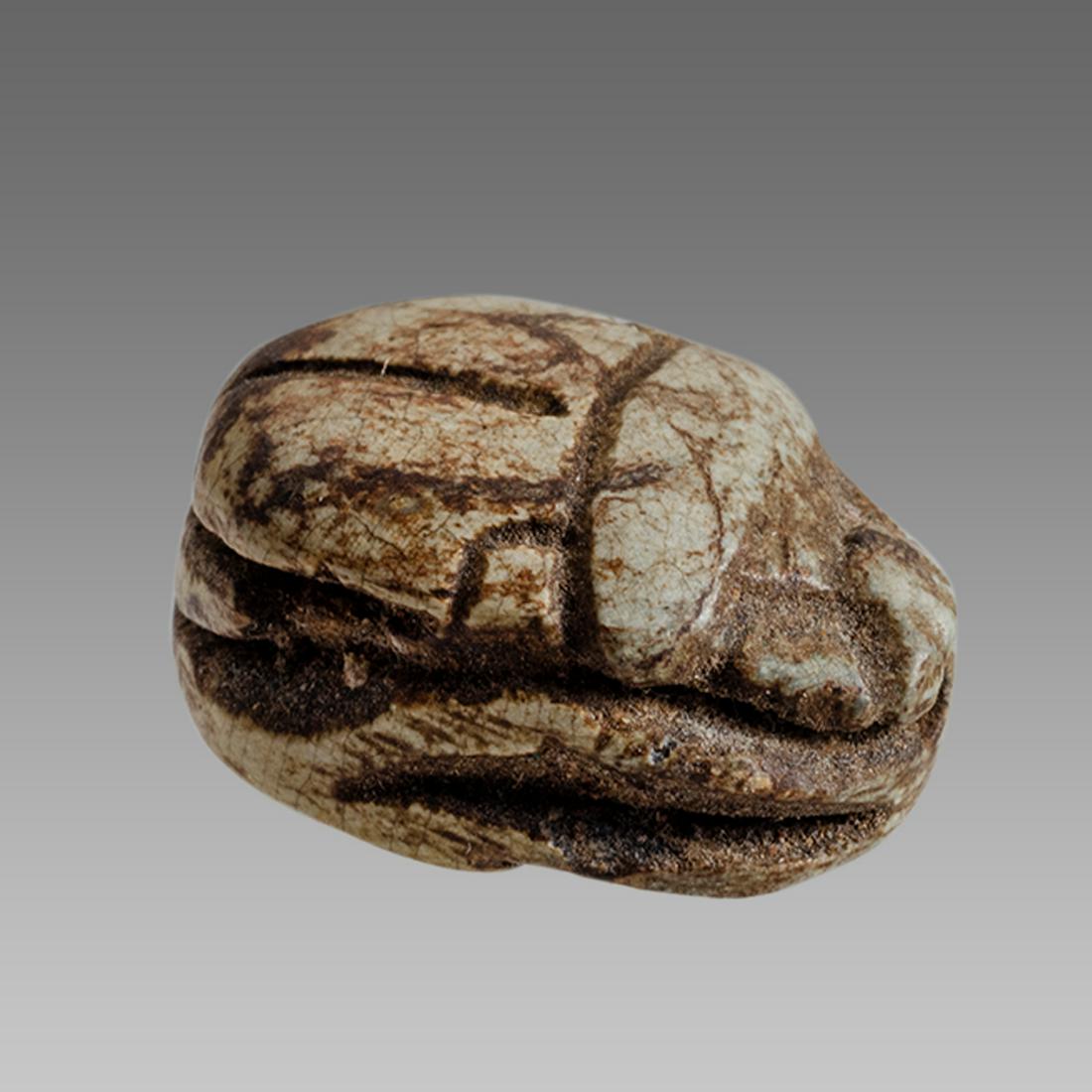 Ancient Egyptian Steatite stone Scarab c.1500-1100 BCE.: Ancient Egyptian Steatite stone Scarab c.1500-1100 BCE. Size 16 x 12 mm. Glazed steatite scarab New Kingdom with stealized beatle back. Provenance: Ex Secret Eyes Gallery New York 1970's-1980's.