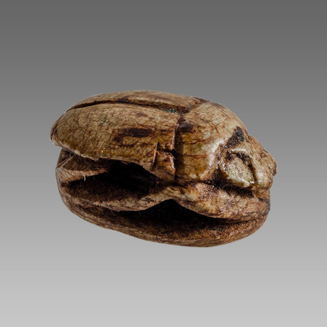 Ancient Egyptian Steatite stone Scarab c.1500-1100 BCE.: Ancient Egyptian Steatite stone Scarab c.1500-1100 BCE. Size 15 x 11 mm. Glazed steatite scarab New Kingdom with stealized beatle back. Provenance: Ex Secret Eyes Gallery New York 1970's-1980's.
