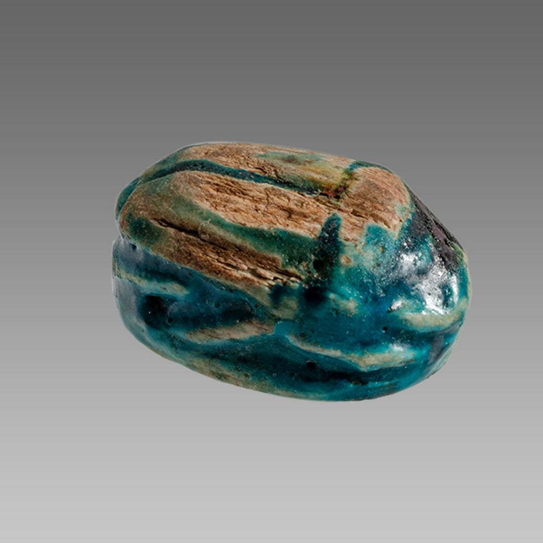 Ancient Egyptian Steatite stone Scarab c.1500-1100 BCE.: Ancient Egyptian Steatite stone Scarab c.1500-1100 BCE. Size 15 x 10 mm. Glazed steatite scarab New Kingdom with stealized beatle back. Provenance: Ex Secret Eyes Gallery New York 1970's-1980's.