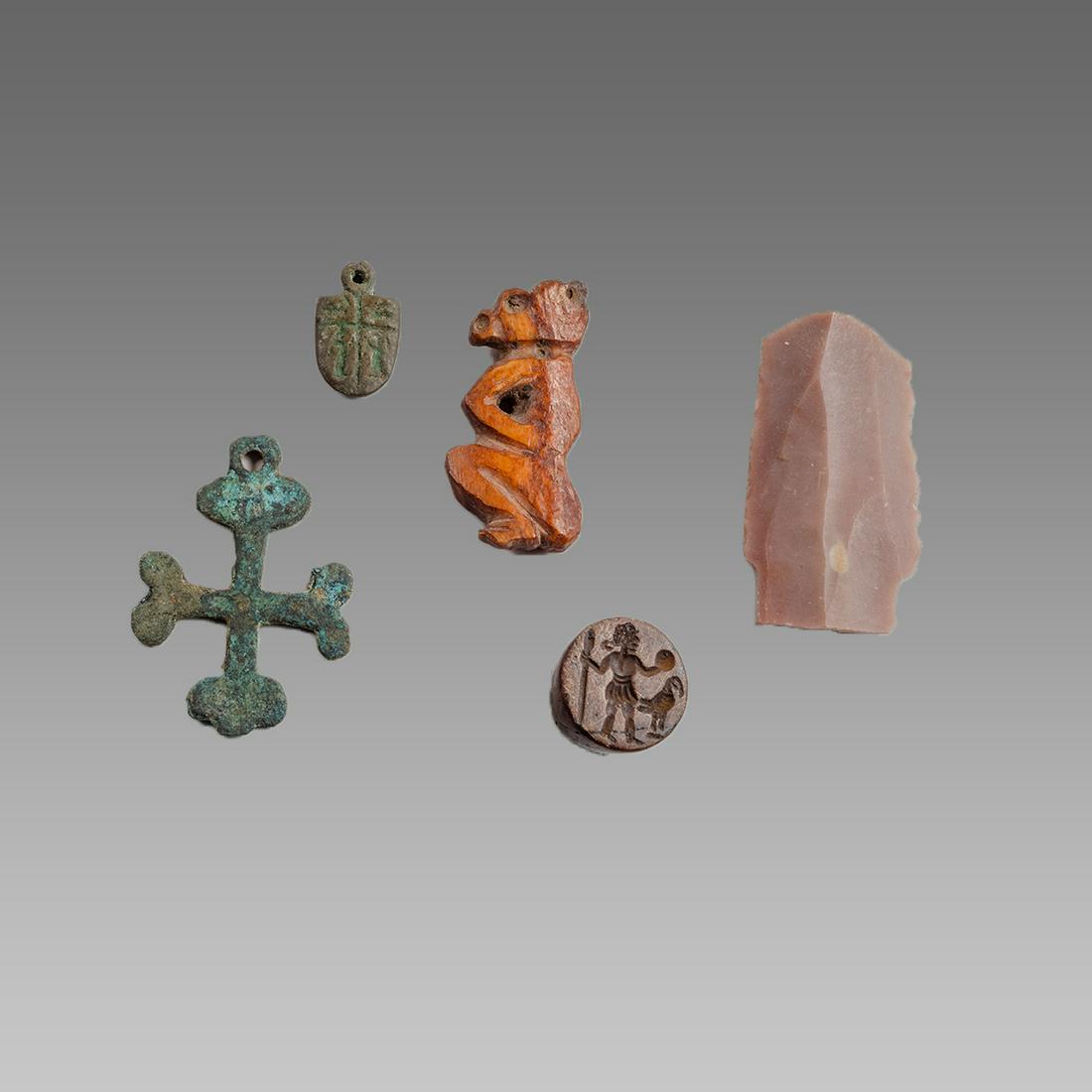 Lot of Byzantine Style Bronze Cross, Misc.: Lot of Byzantine Style Bronze Cross, Misc. Size 1 - 2 inches. Cast bronze cross and amulet, together with Carved bone animal, stone seal engraved with figure and Stone part of axe. Not ancient. Ex Pri