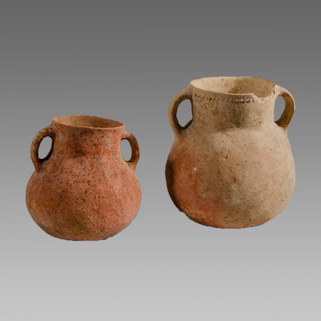 Ancient Holy Land Bronze Age Terracotta Vessels c.2100: Ancient Holy Land Bronze Age Terracotta Vessels c.2100 BC (2). Size 4 1/2 - 5 1/2 inches high. Fine Terracotta jars with twin handles. Ex Private NYC collection acquired prior to 1990's