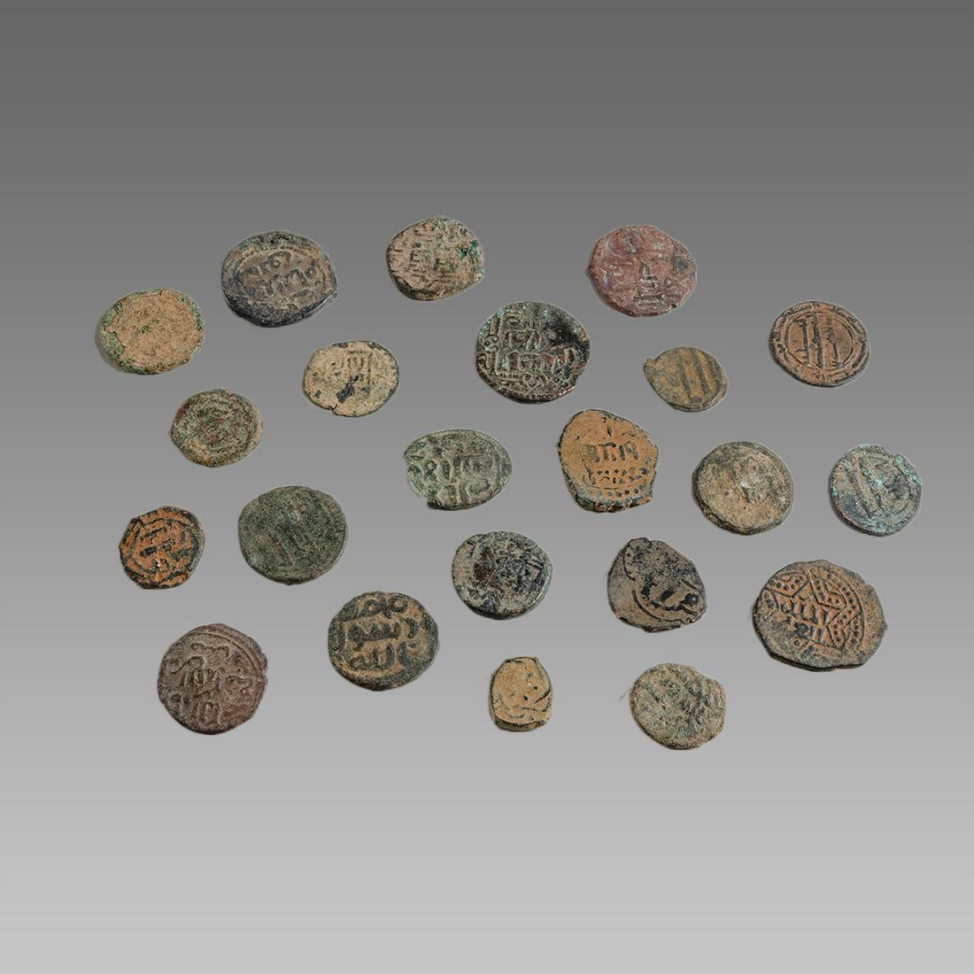 Lot of 22 Islamic Bronze coins c.8th century AD.: Lot of 22 Islamic Bronze coins c.8th century AD. Size 13 - 22 mm. Mixed types Islamic bronze coins.
