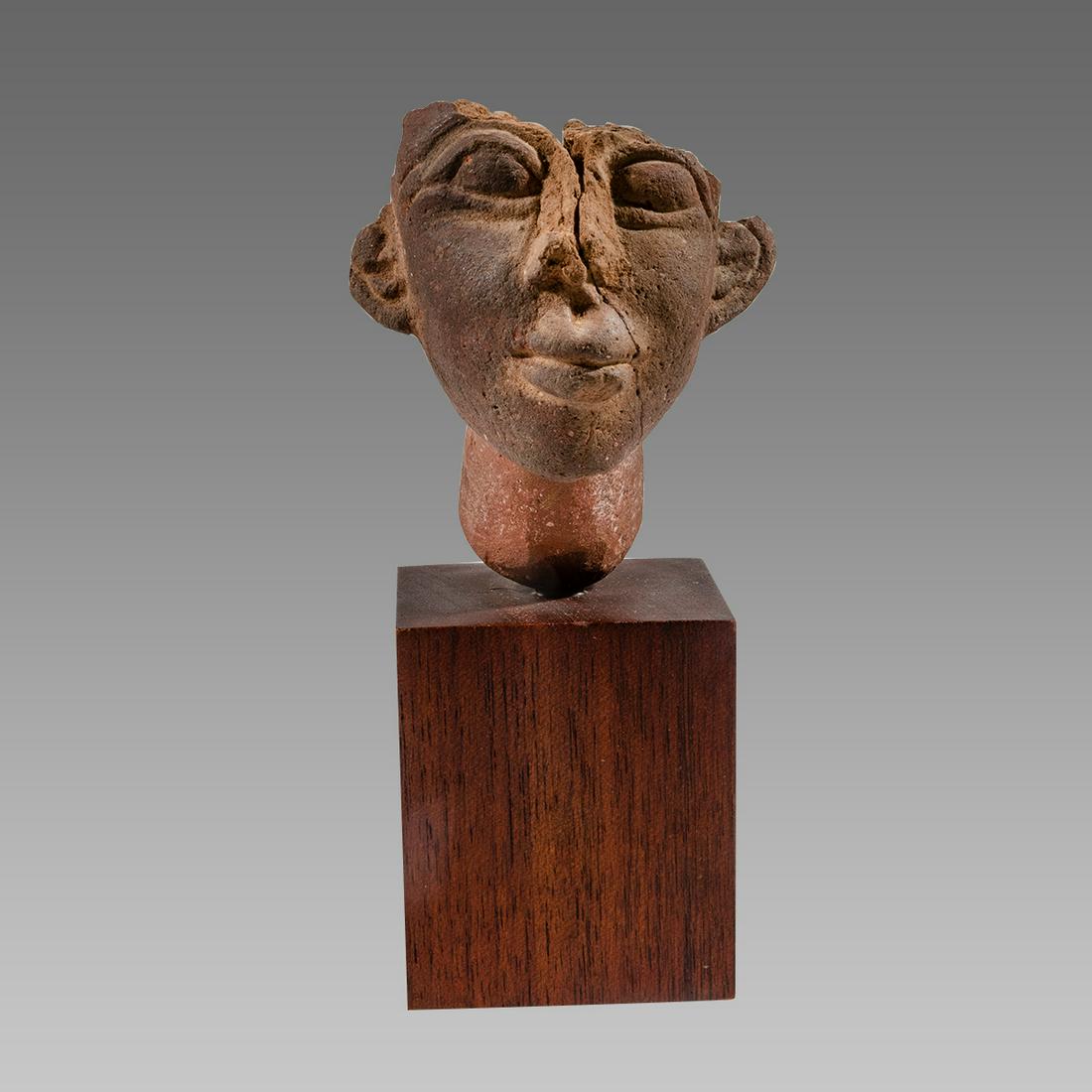 Egyptian Style Terracotta head of Akhenaten.: Egyptian Style Terracotta head of Akhenaten. Size 4 inches high. + mount. Fine molded head of the Egyptian King Akhenaten. fine details. custom mounted on wooden block. Provenance: Ex Private Maryland