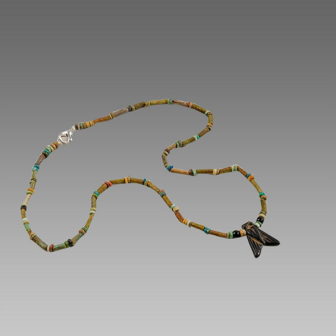 Ancient Egyptian Faience Beads Necklace with Fly Amulet: Ancient Egyptian Faience Beads Necklace with Fly Amulet c.300-50 BC. Size 17 3/4 inches length. Great Looking single strand Faience Beads necklace late period 300-50 BC, with Fly stone amulet. Provena