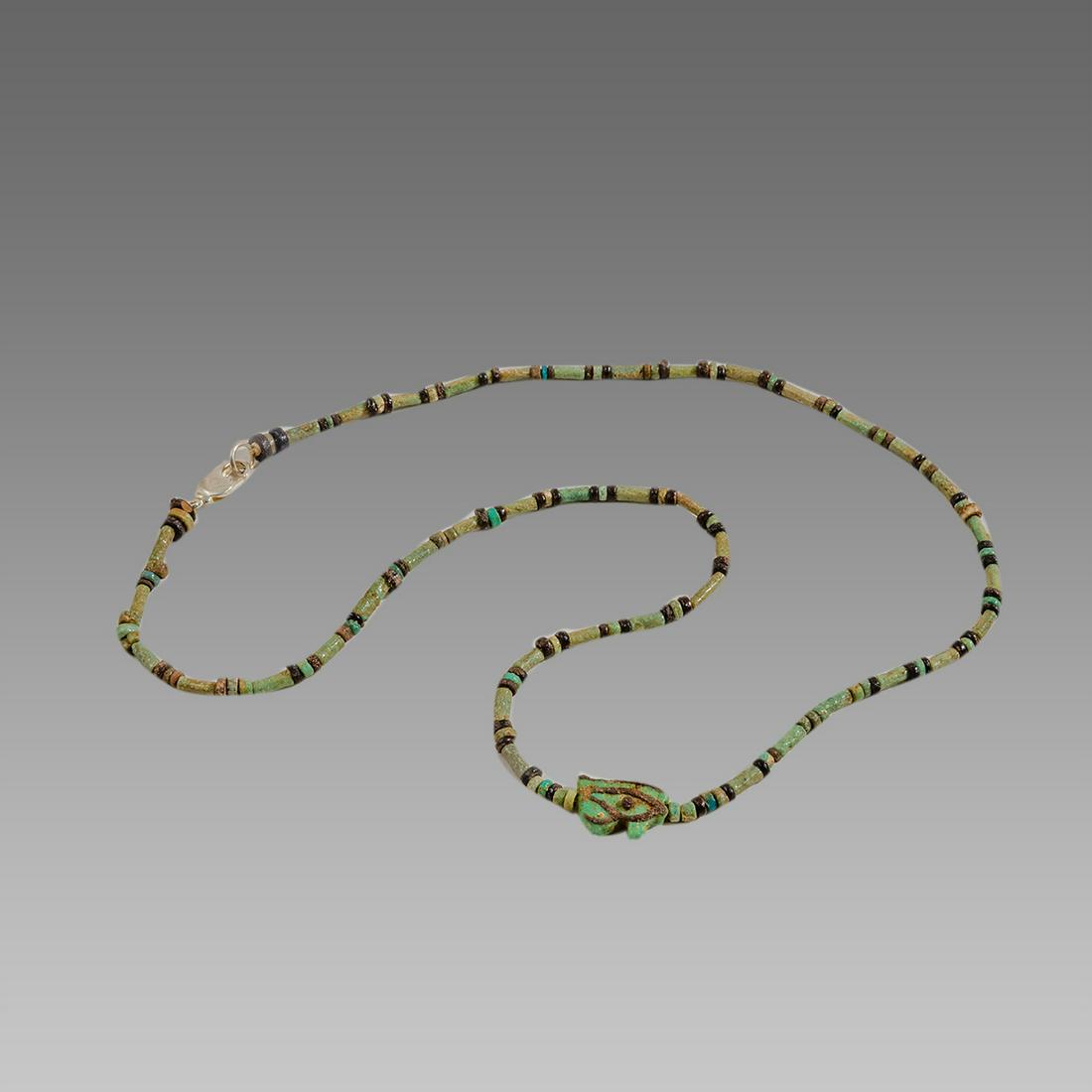 Ancient Egyptian Faience Beads Necklace with Wedjat: Ancient Egyptian Faience Beads Necklace with Wedjat Amulet c.300-50 BC. Size 19 1/4 inches length. Great Looking single strand Faience Beads necklace late period 300-50 BC, with Wedjat eye of Horus fa