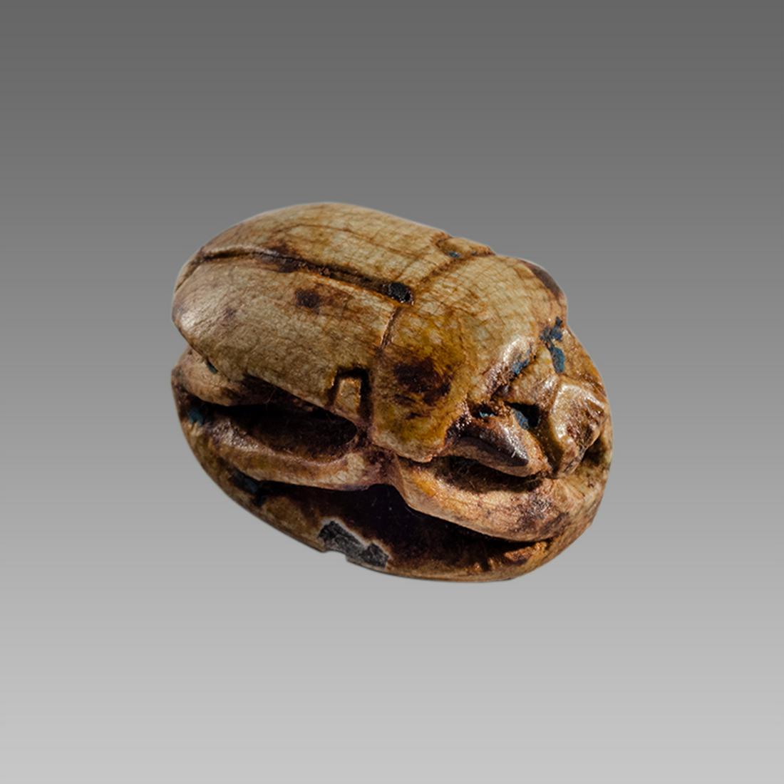 Ancient Egyptian Steatite stone Scarab c.1500-1100 BCE.: Ancient Egyptian Steatite stone Scarab c.1500-1100 BCE. Size 15 x 11 mm. Glazed steatite scarab New Kingdom with stealized beatle back. Provenance: Ex Secret Eyes Gallery New York 1970's-1980's.