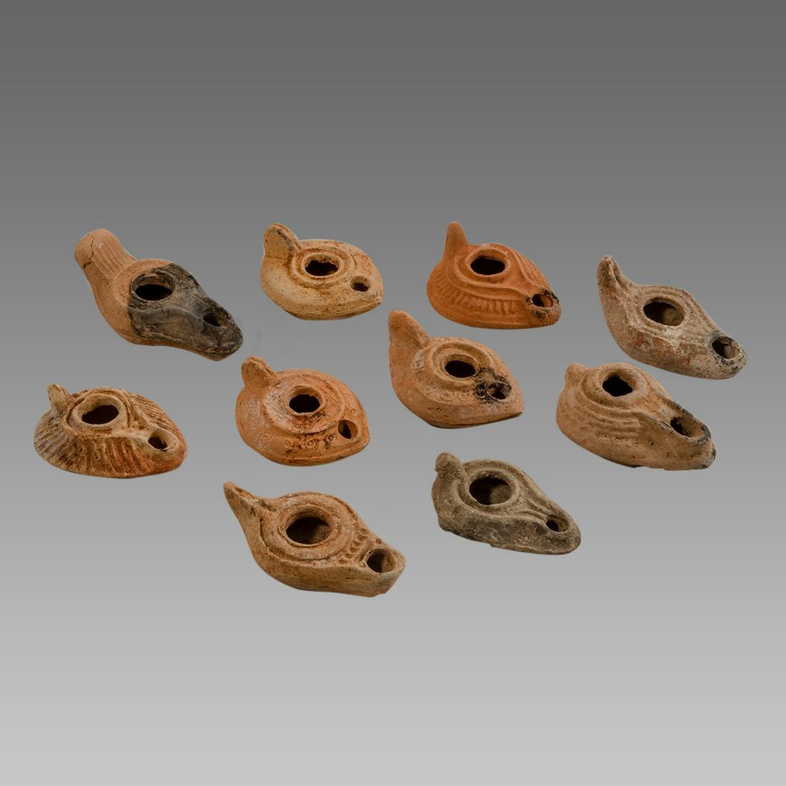 Lot of 10 Ancient Roman, Byzantine Terracotta Oil Lamps: Lot of 10 Ancient Roman, Byzantine Terracotta Oil Lamps c.1st-5th century AD. Size 3 1/4 - 4 1/2 inches length. Great lot of 10 Ancient Roman and Byzantine period terracotta oil lamps. Provenance: Fro