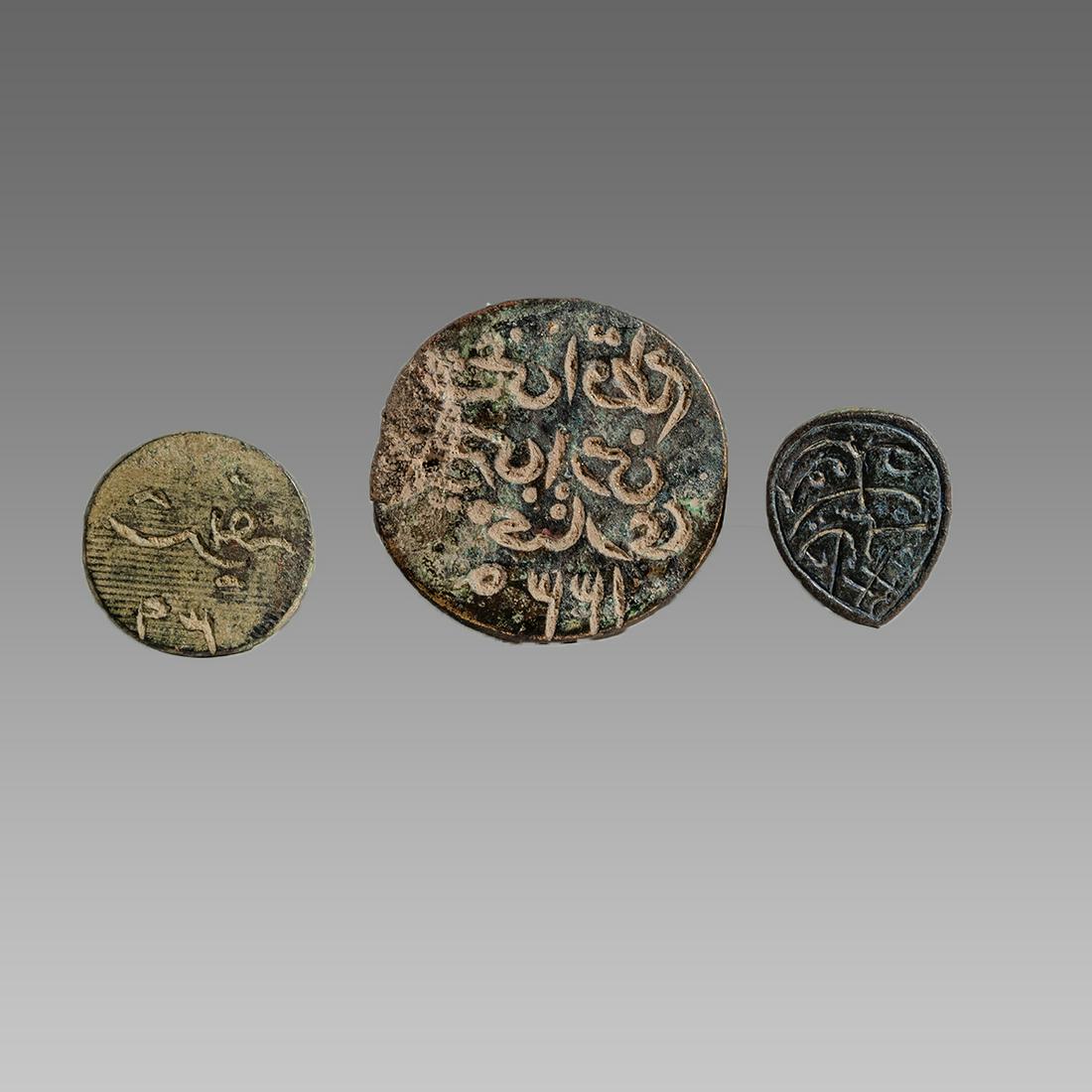 Lot of 4 Islamic Bronze Seals c.18th century AD.: Lot of 4 Islamic Bronze Seals c.18th century AD. Size 1 - 1 1/4 inches length. A collection of 3 islamic bronze seals with Arabic inscriptions with suspension handles, together with lead amulet. Ex Pr