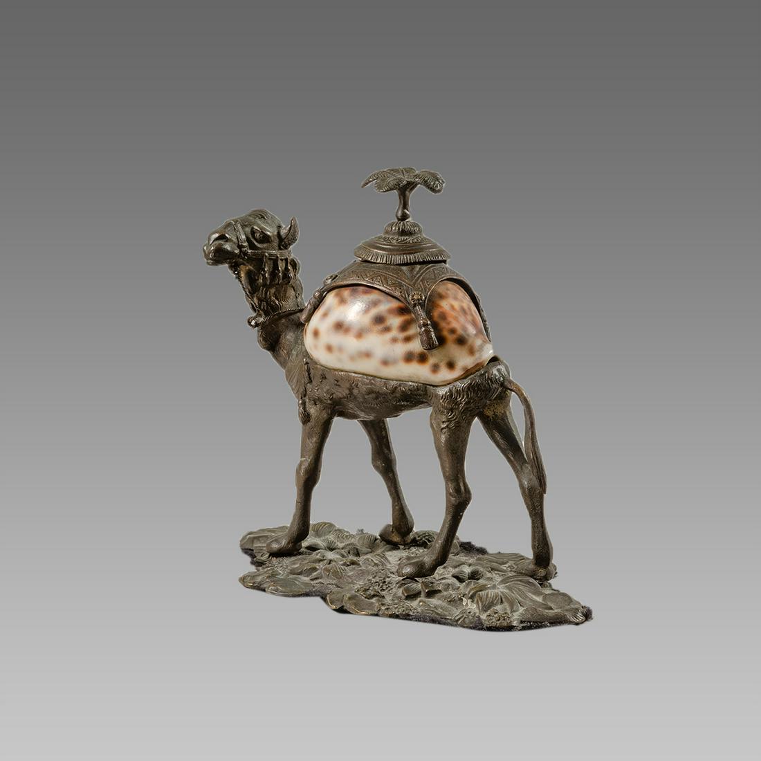 A Patinated Metal Camel Vessel with Shell.: A Patinated Metal Camel Vessel with Shell. Size 6 1/4 inches high. Metal camel with Shell body, with lid.