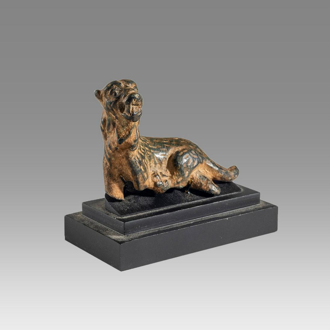 Ancient Roman Bronze Lioness c.2nd century AD.: Ancient Roman Bronze Lioness c.2nd century AD. Size 1 3/4 inches length.+ mount. Fine cast bronze figure of lioness reclining facing, fine patina and details. custom mounted. Ex Private NYC collection