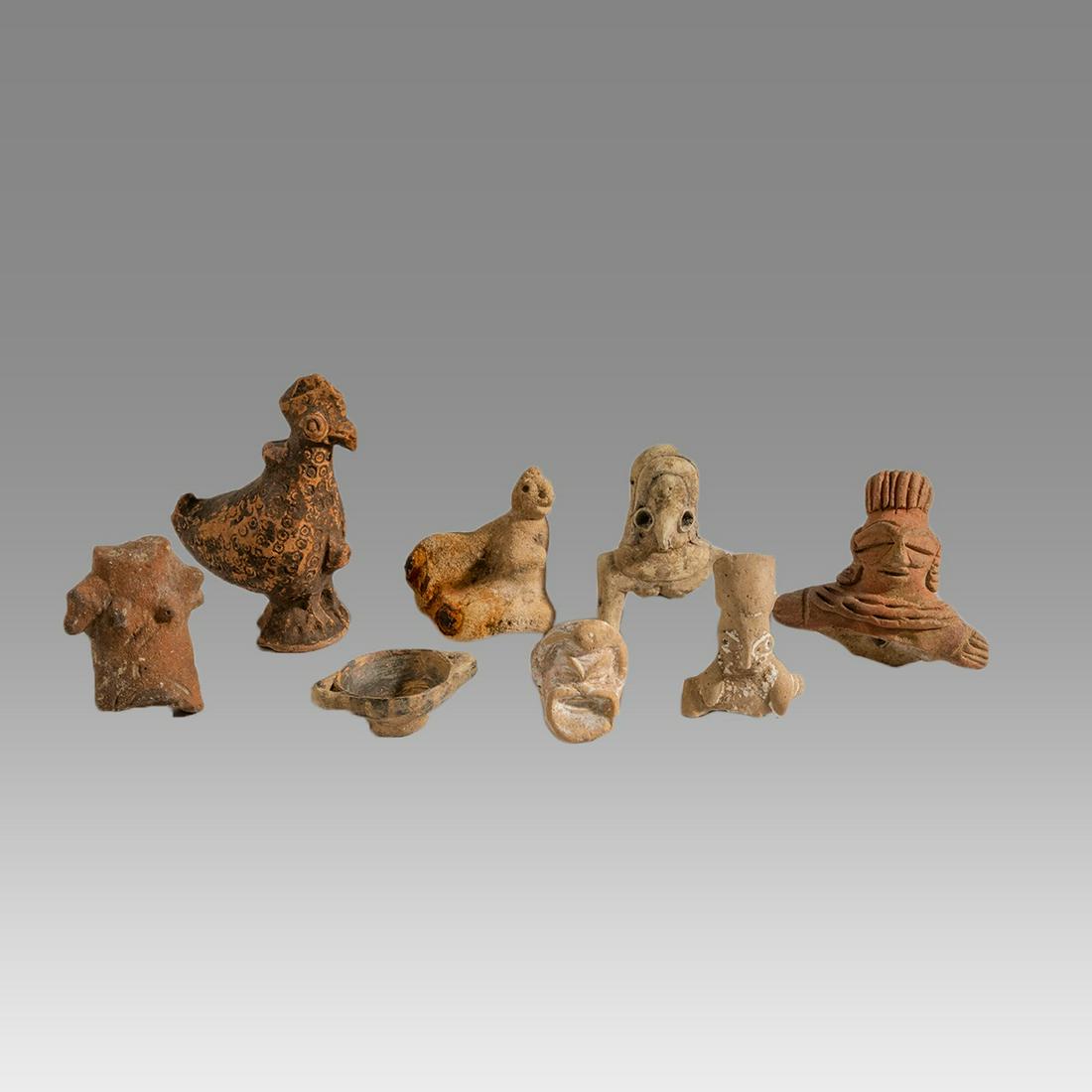 Lot of 8 Ancient Terracotta figure fragments. (1 of 2)