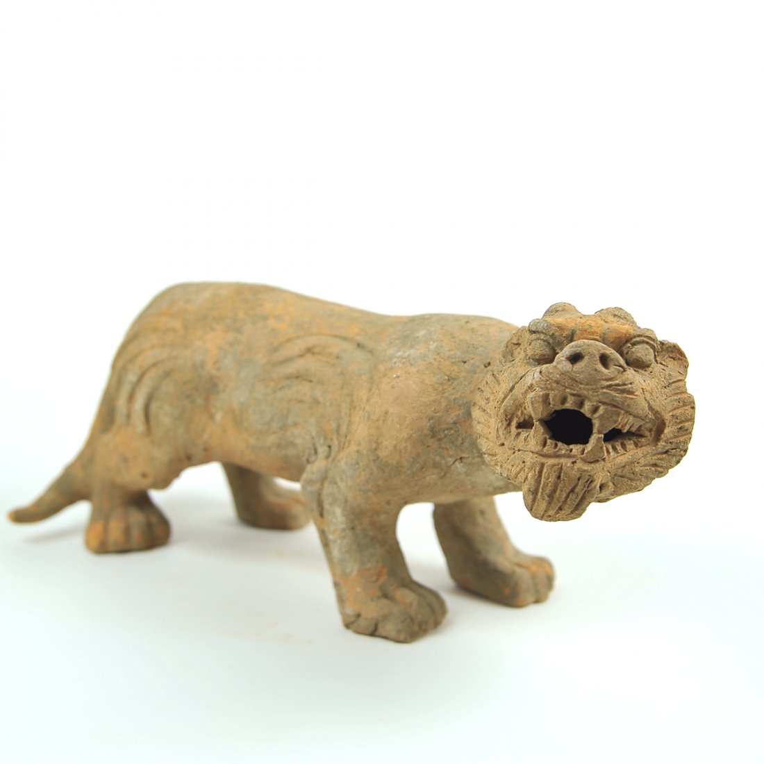 Chinese Han Dynasty Pottery Tiger.: Chinese Han Dynasty Pottery Tiger. Size 14 1/2 inches length, 7 1/2 inches high. Large pottery Tiger standing on attack mode.