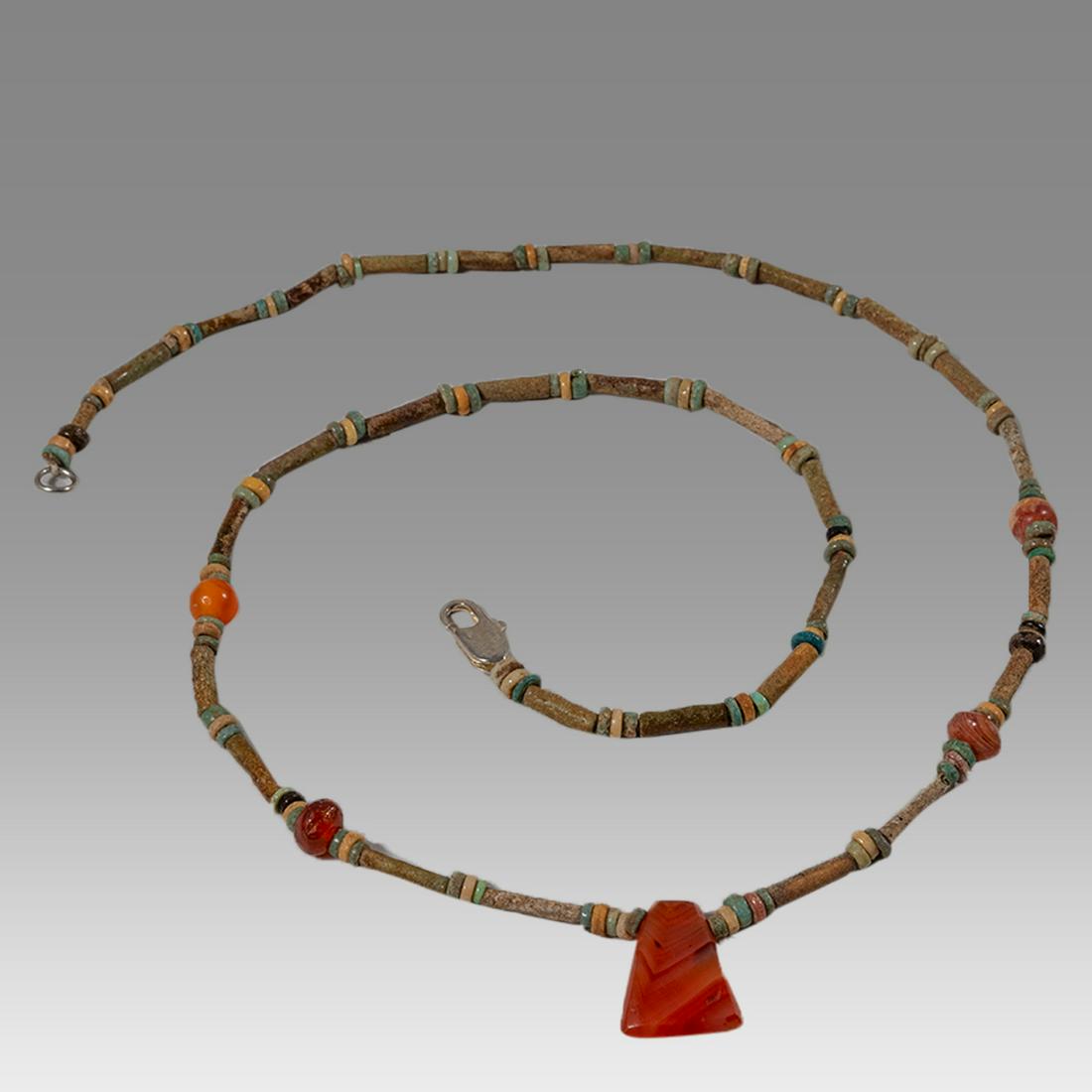 Ancient Egyptian Faience Bead Necklace c.300-50 BC.: Ancient Egyptian Faience Bead Necklace c.300-50 BC. Size 21 3/4 inches length. Great Looking single strand Faience Bead necklace mixed with carnelian beads, late period 300-50 BC. wearable. Provenance