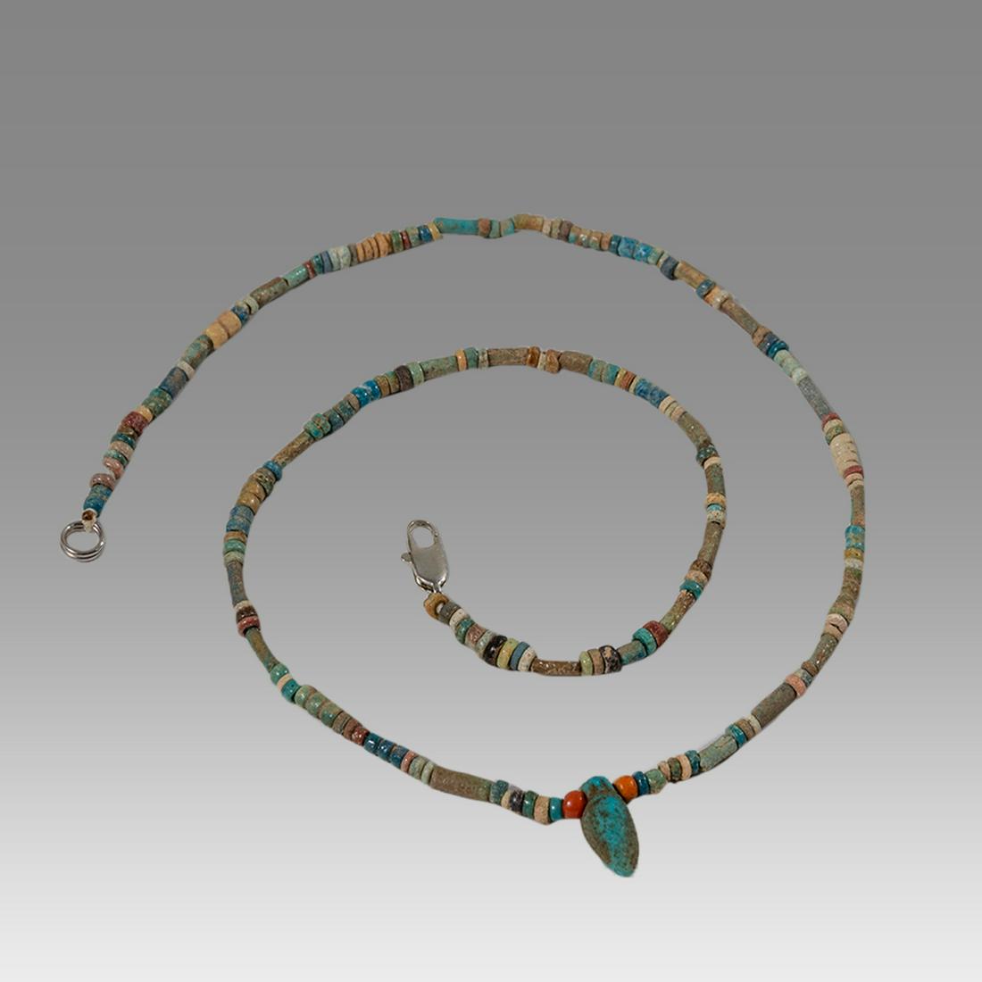Ancient Egyptian Faience Bead Necklace c.300-50 BC.: Ancient Egyptian Faience Bead Necklace c.300-50 BC. Size 17 3/4 inches length. Great Looking single strand Faience Bead necklace with heart amulet, late period 300-50 BC. wearable. Provenance: Ex Secr
