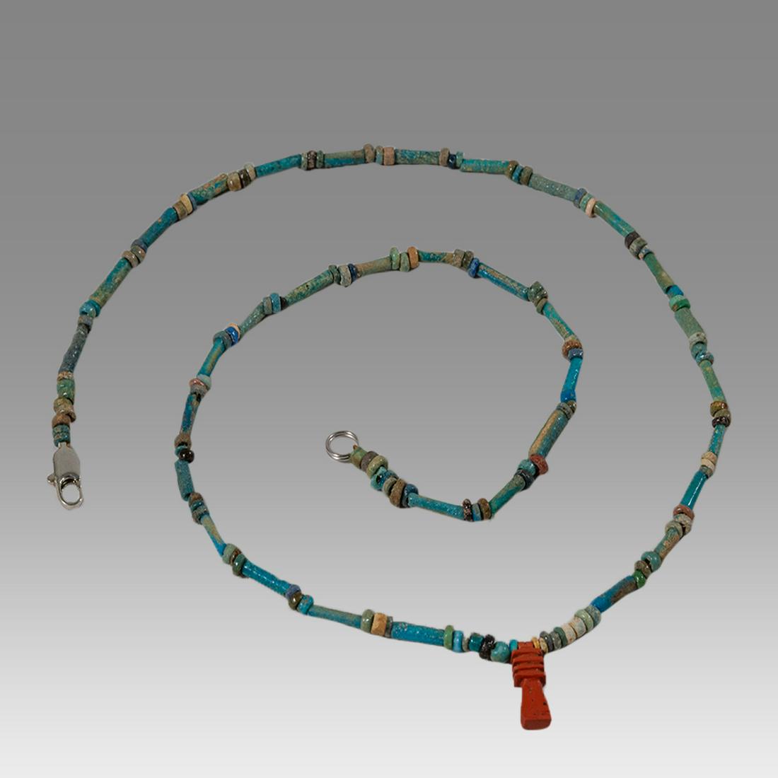 Ancient Egyptian Faience Bead Necklace c.300-50 BC.: Ancient Egyptian Faience Bead Necklace c.300-50 BC. Size 19 1/4 inches length. Great Looking single strand Faience Bead necklace with amulet, late period 300-50 BC. wearable. Provenance: Ex Secret Eye