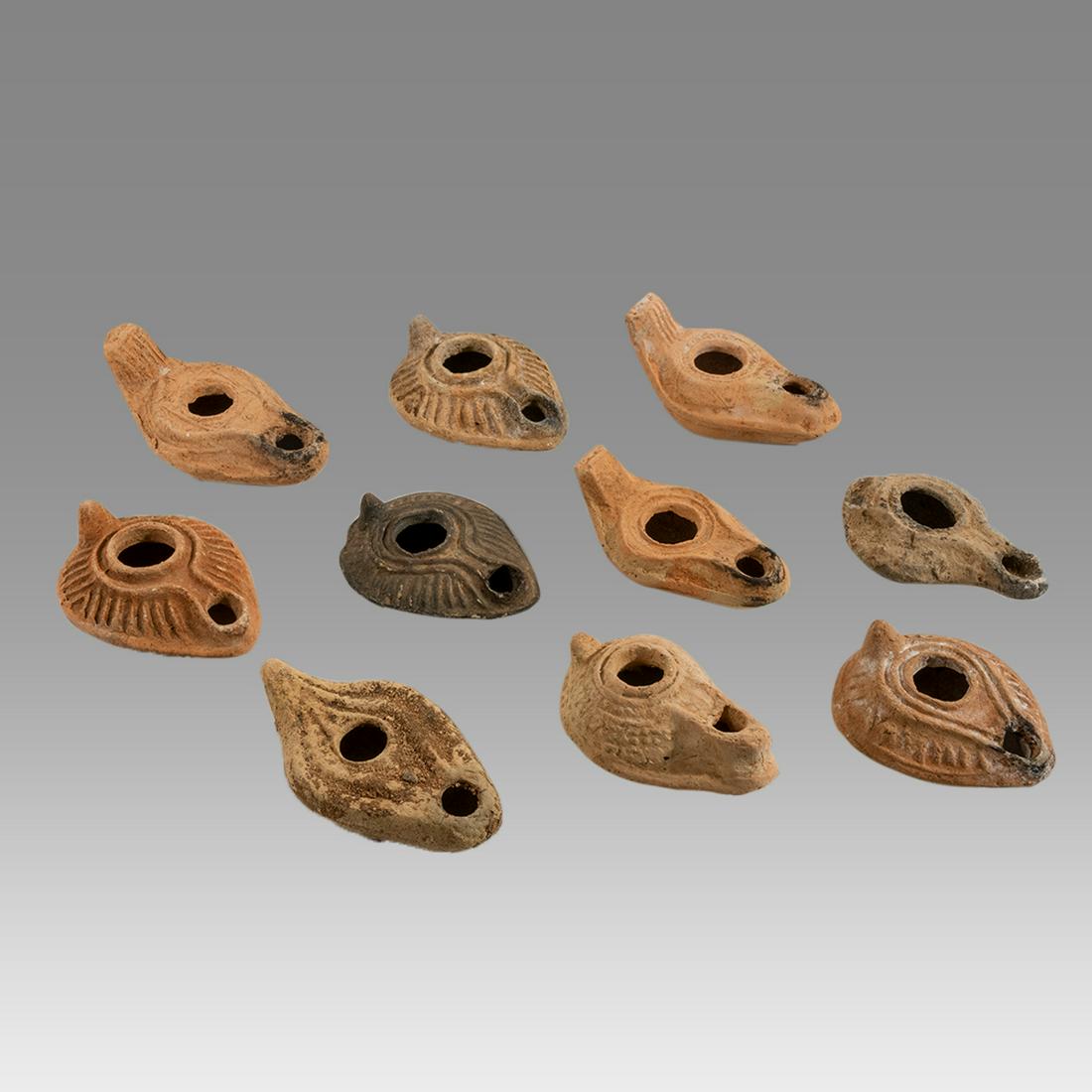 Lot of 10 Ancient Roman, Byzantine Terracotta Oil Lamps: Lot of 10 Ancient Roman, Byzantine Terracotta Oil Lamps c.1st-5th century AD. Size 3 5/8 - 4 1/4 inches length. Great lot of 10 Ancient holy land Roman and Byzantine period terracotta oil lamps, great