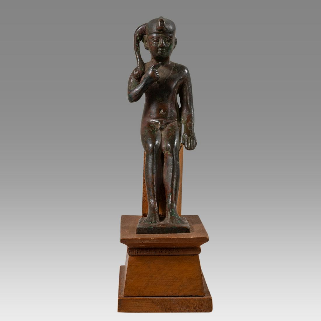 Large Ancient Egyptian Bronze Harpokrates Figure Late: Large Ancient Egyptian Bronze Harpokrates Figure Late Period, ca. 600 - 300 BC. Size 5 1/4 inches high + mount. Fine cast bronze seated figure of Harpokrates nude, legs together with feet on a square 