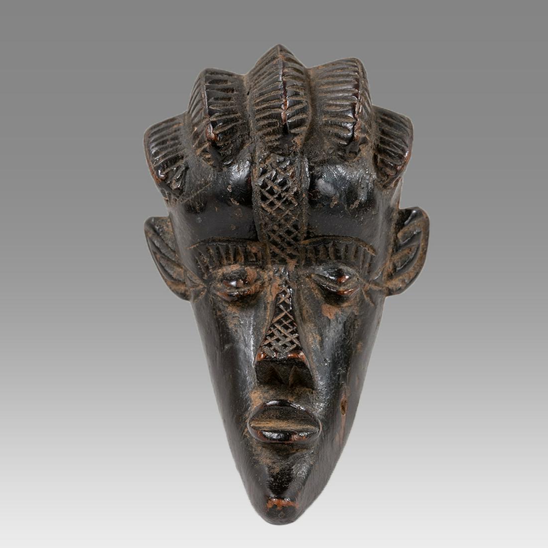 Africa, Wood mask c.20th century.: Africa, Wood mask c.20th century. Size 3 7/8 x 2 inches. Africa, Wood passport mask c.20th century. Great quality and details.