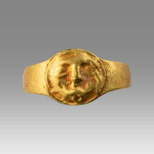 Ancient Roman Gold Ring with Face c.1st century AD.: Ancient Roman Gold Ring with Face c.1st century AD. Size 12 mm. weight 1.0 gram. Fine High karat gold child ring with face. Provenance: Private NYC Collection acquired in the USA Market.