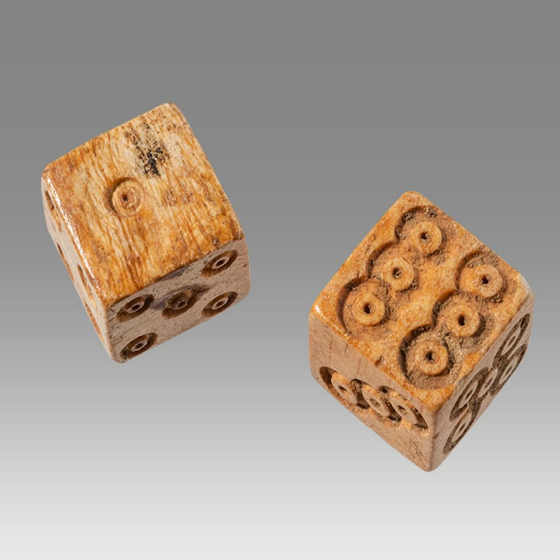 Ancient Roman Bone Pair of Dice c.1st-4th century AD.: Ancient Roman Bone Pair of Dice c.1st-4th century AD. Size 14 mm. Fine matching pair of Roman carved bone dice. Provenance: Private NYC Collection acquired in the USA Market.
