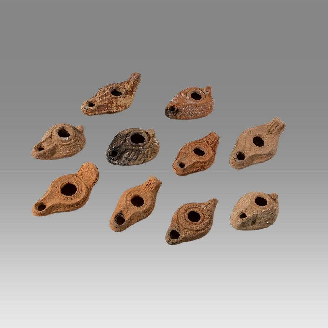 Lot of 10 Ancient Roman, Byzantine Terracotta Oil Lamps c.1st-5th century AD.: Lot of 10 Ancient Roman, Byzantine Terracotta Oil Lamps c.1st-5th century AD. Size 3 1/2 - 4 1/4 inches length. Great lot of 10 Ancient holy land Roman and Byzantine period terracotta oil lamps, great