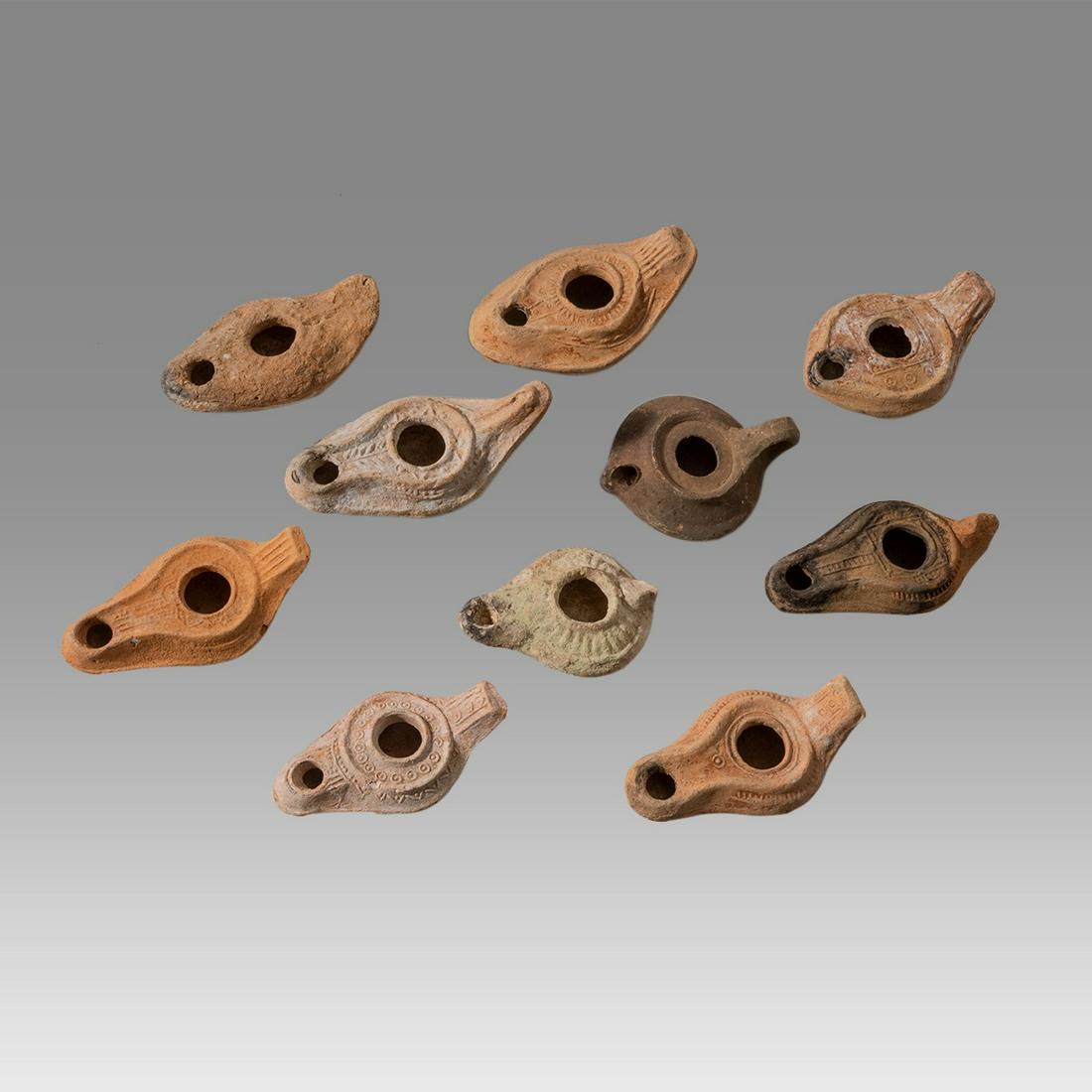 Lot of 10 Ancient Roman, Byzantine Terracotta Oil Lamps c.1st-5th century AD.: Lot of 10 Ancient Roman, Byzantine Terracotta Oil Lamps c.1st-5th century AD. Size 3 1/4 - 4 1/2 inches length. Great lot of 10 Ancient holy land Roman and Byzantine period terracotta oil lamps, great
