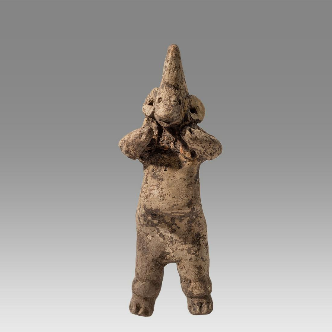 Tlatilco Pregnant Woman with Snouted Face Ca. 1150-550 B.C. Tlatilco, Mexico.: Tlatilco Pregnant Woman with Snouted Face Ca. 1150-550 B.C. Tlatilco, Mexico. Size 3 7/8 inches high. Tan-buff pottery standing female showing full pregnance and holding her nubbin hands beneath her c