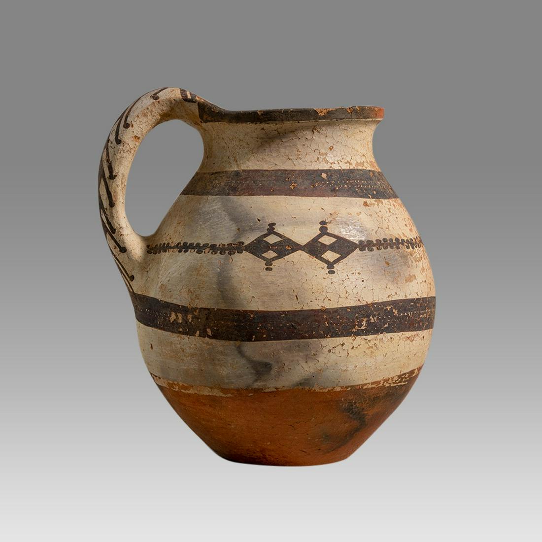 Ancient Central Asian Pottery Olpe c.800 BC.: Ancient Central Asian Pottery Olpe c.800 BC. Size 7 3/4 inches high, 7 3/4 inches diameter widest point. A large pottery Olpe Jug decorated with ornate design. Ex Michigan collection, acquired from Ar