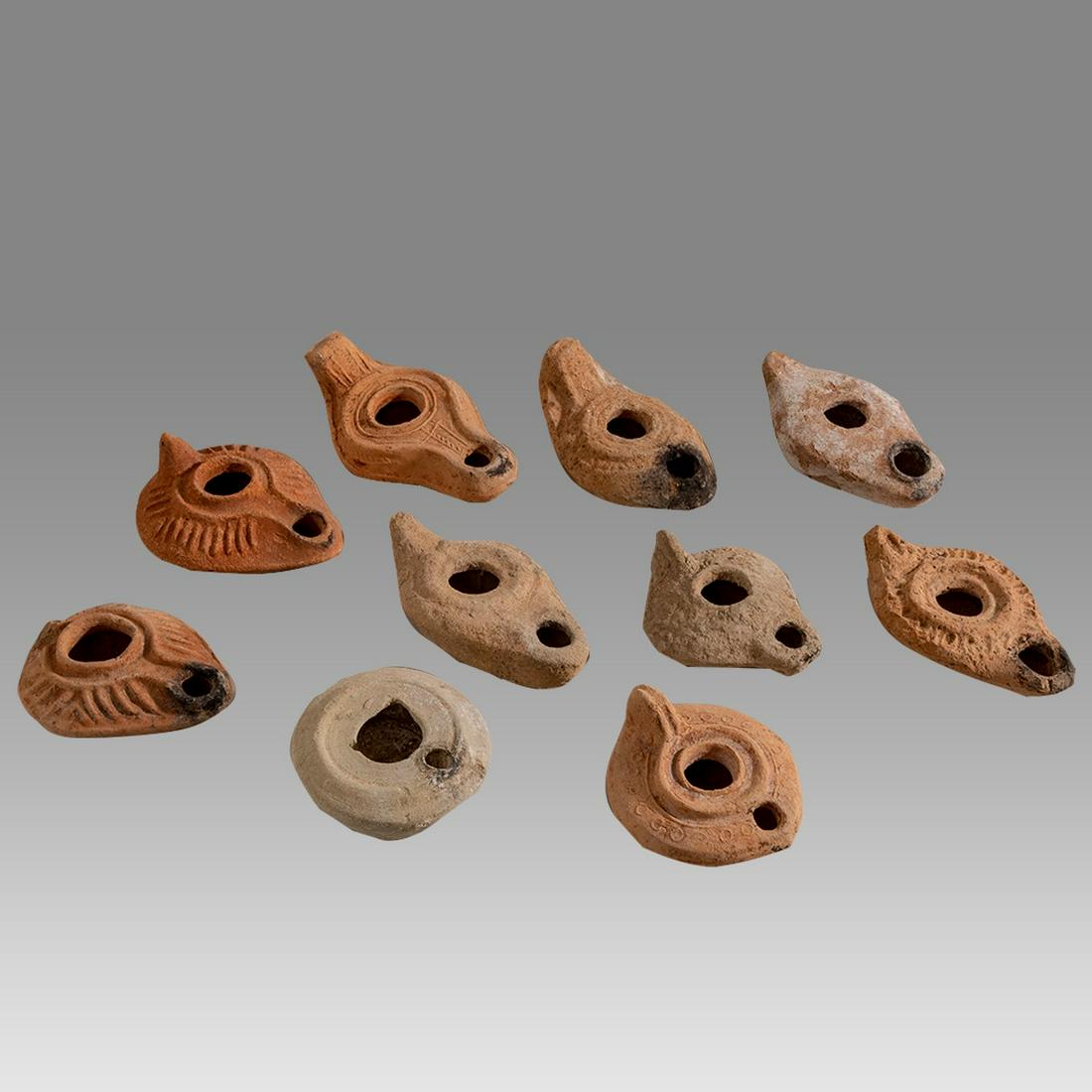 Lot of 10 Ancient Roman, Byzantine Terracotta Oil Lamps c.1st-5th century AD.: Lot of 10 Ancient Roman, Byzantine Terracotta Oil Lamps c.1st-5th century AD. Size 3 - 4 1/4 inches length. Great lot of 10 Ancient holy land Roman and Byzantine period terracotta oil lamps, great qua