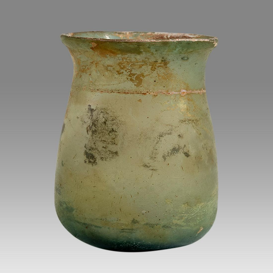 Ancient Roman Large Glass Cup c.2nd-4th Century A.D.: Ancient Roman Large Glass Cup c.2nd-4th Century A.D. Size 3 1/8 inches high. Fine Roman Glass Wine cup with applied glass ring at shoulder, flared rim. with nice patina. Provenance: Property of David 
